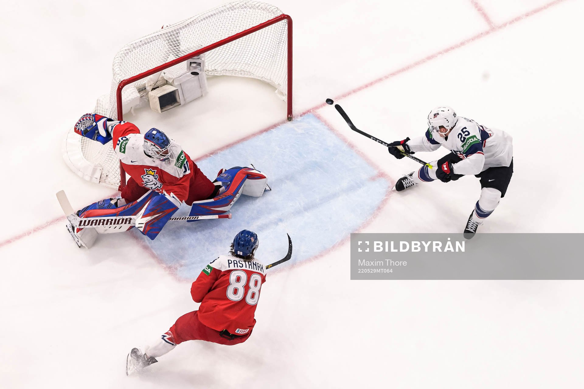 Karson Kaulman of USA scores a goal behind goaltender Karel
