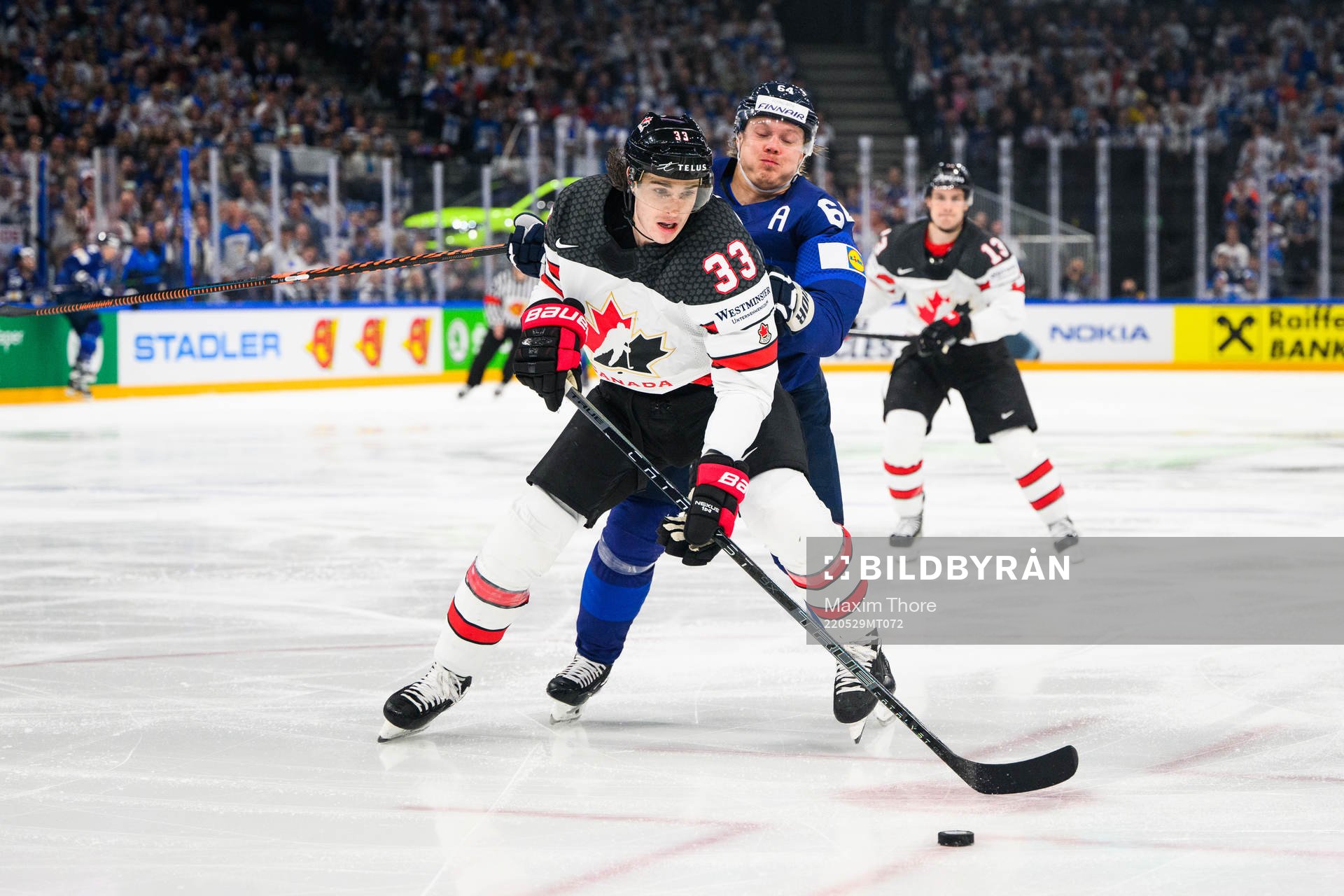 Ryan Graves of Canada and Mikael Granlund of Finland