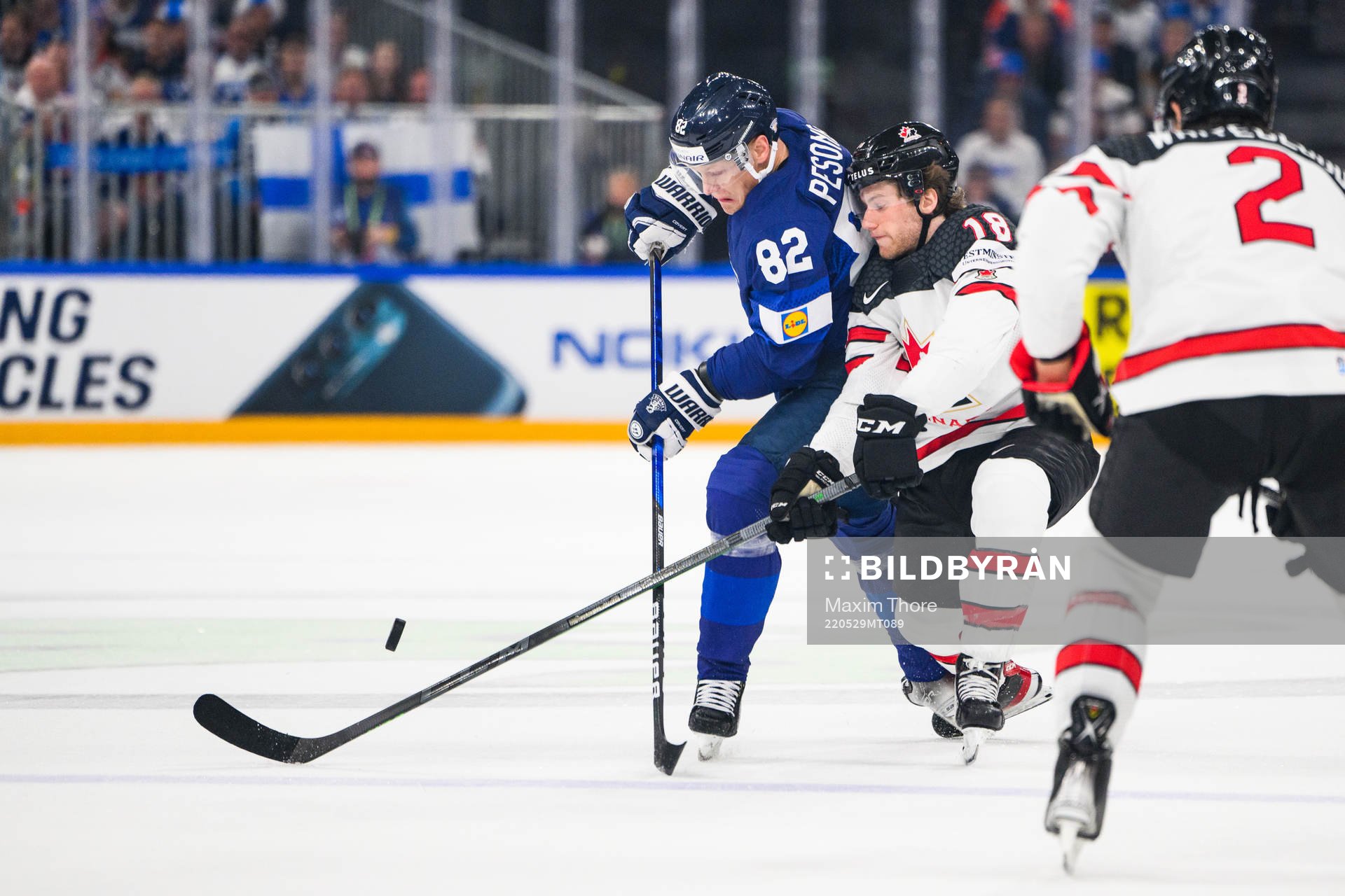 Harri Pesonen of Finland and Dawson Mercer of Canada