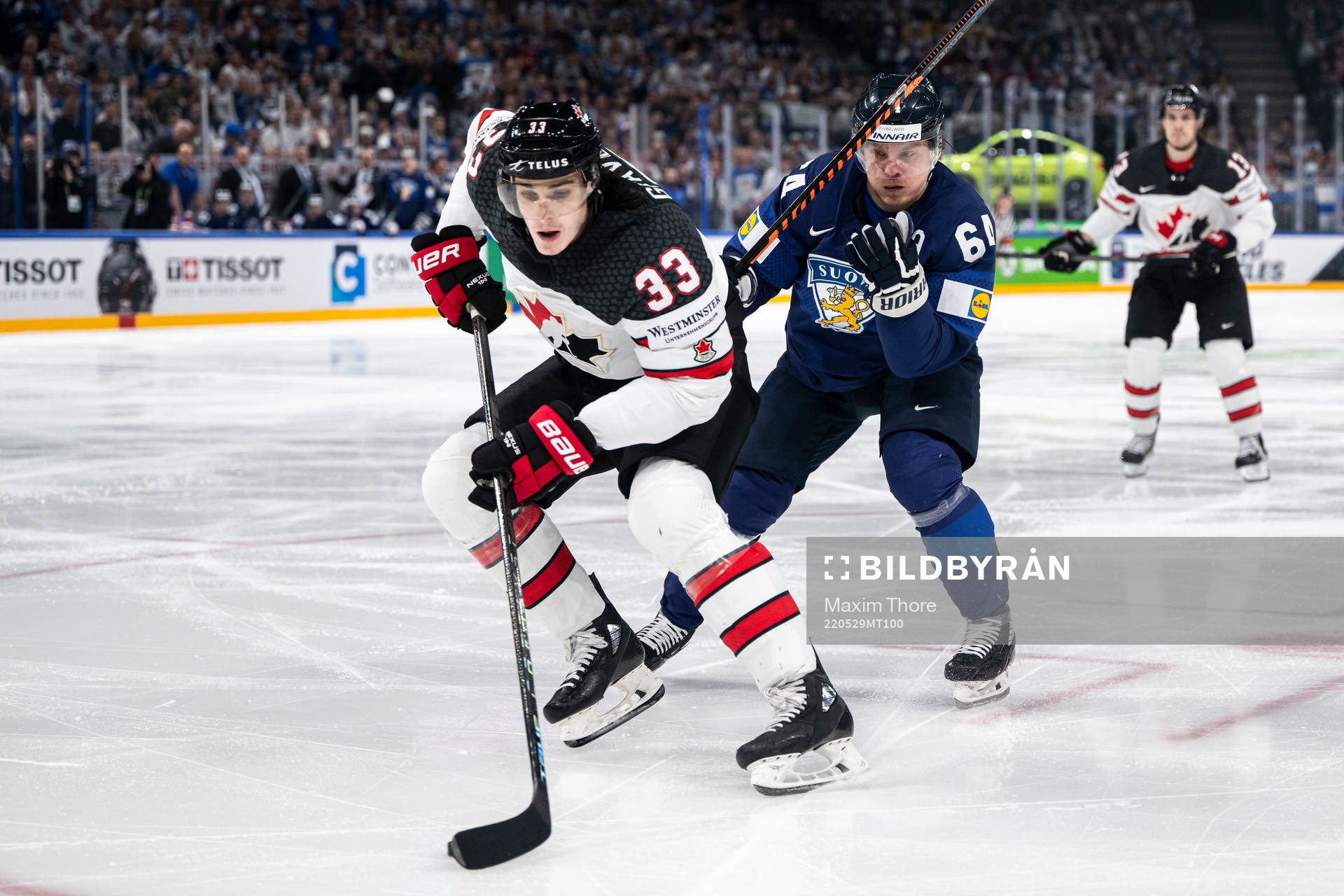 Ryan Graves of Canada and Mikael Granlund of Finland