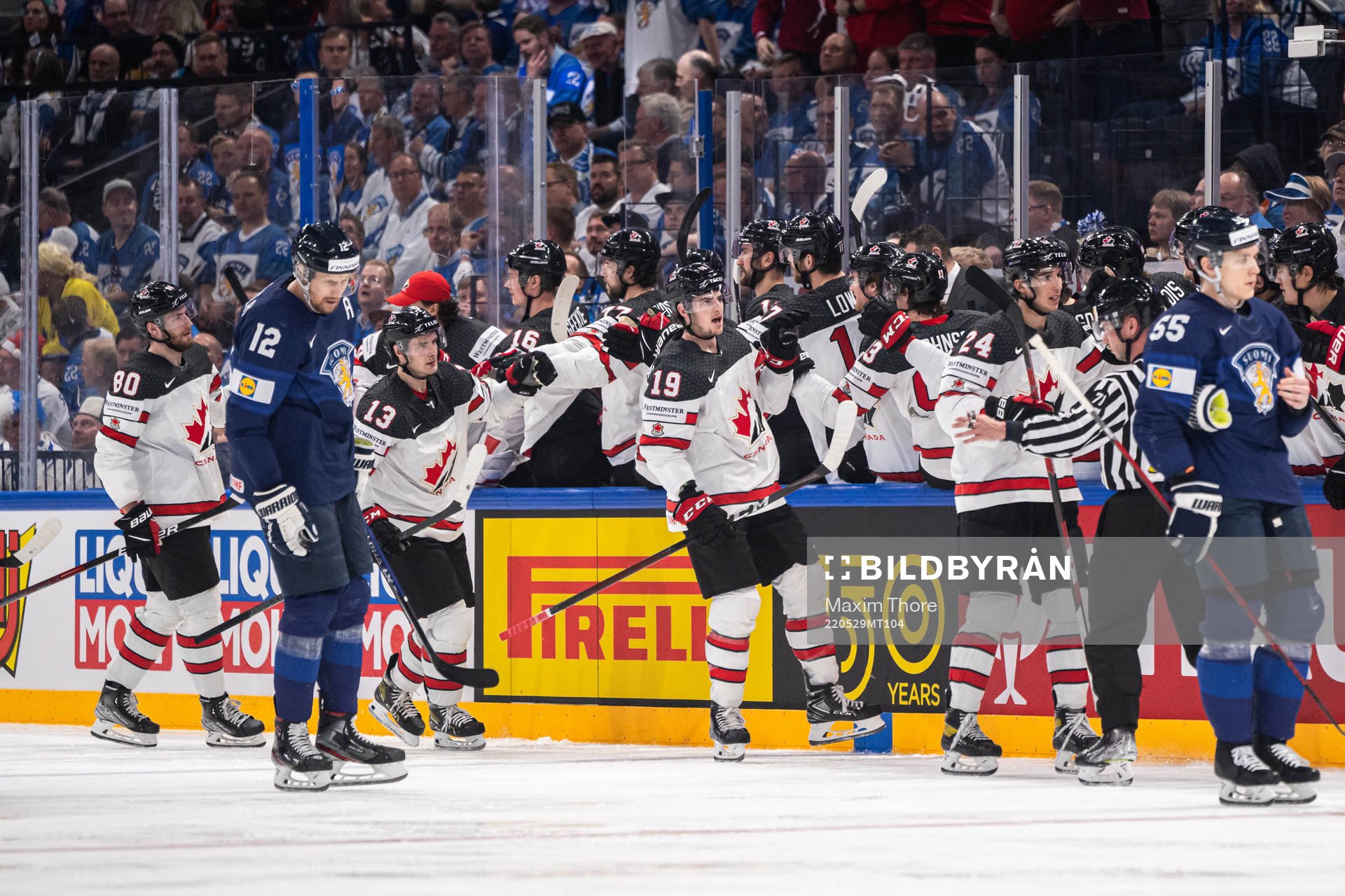 Drake Batherson and Dylan Cozens of Canada celebrates