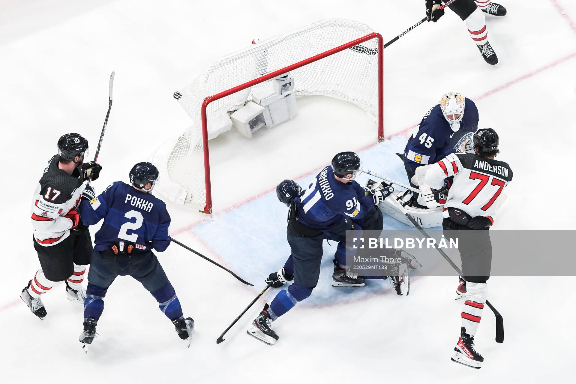 Zach Whitecloud of Canada (not in frame) scores 3-2 behind