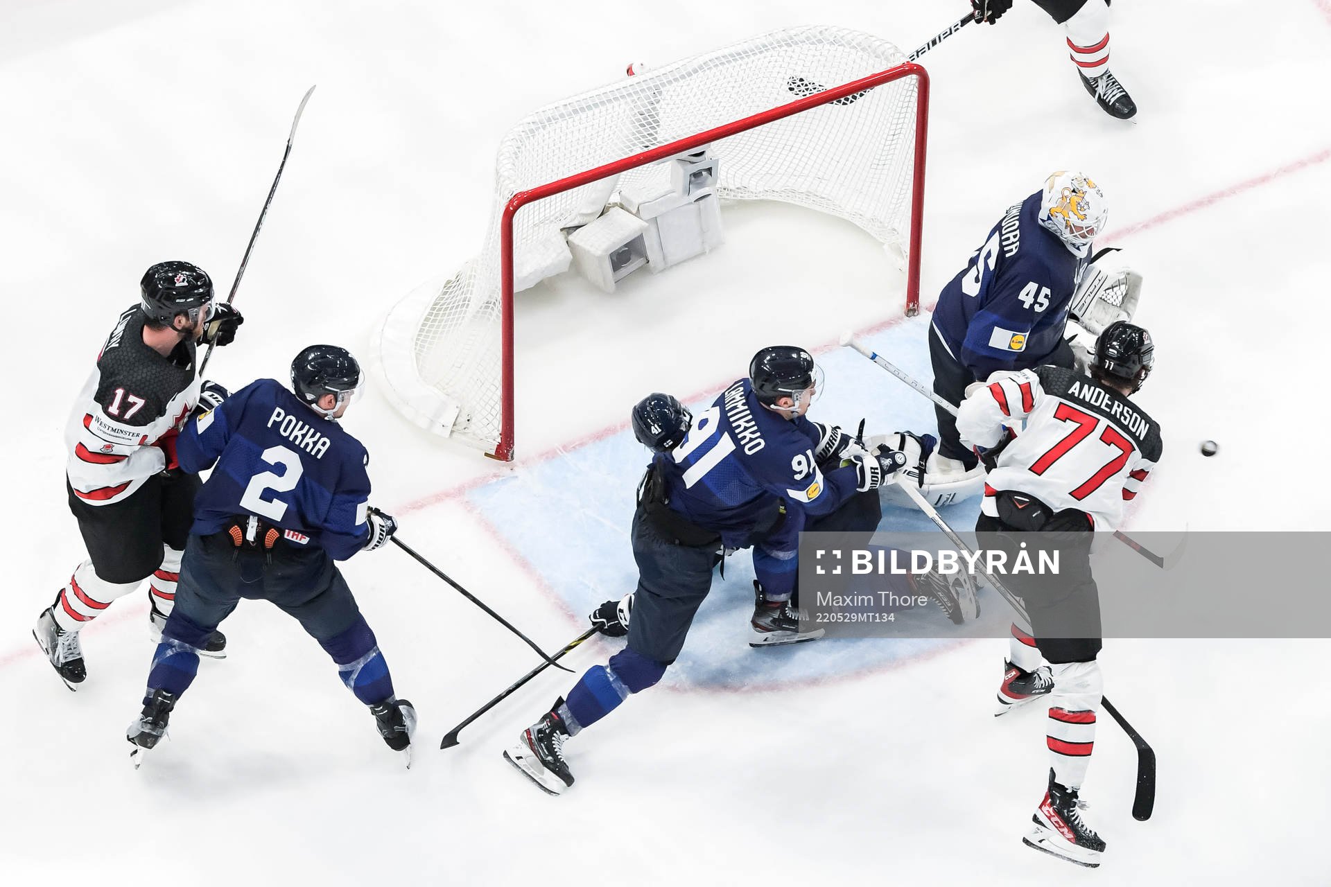Zach Whitecloud of Canada (not in frame) scores 3-2 behind