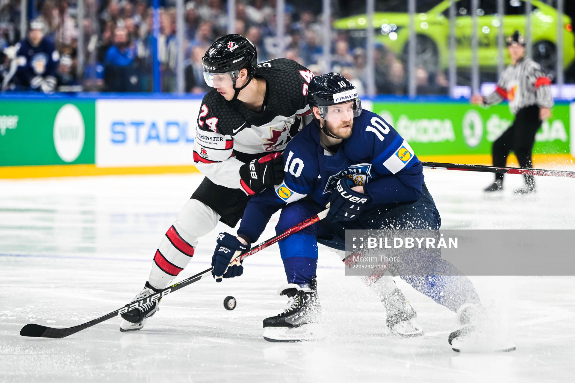 Dylan Cozens of Canada and Joel Armia of Finland