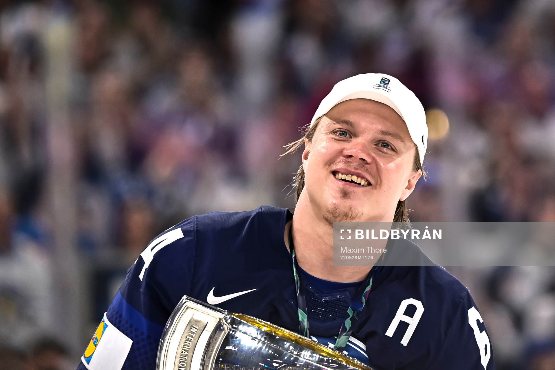 Mikael Granlund of Finland celebrate with the trophy