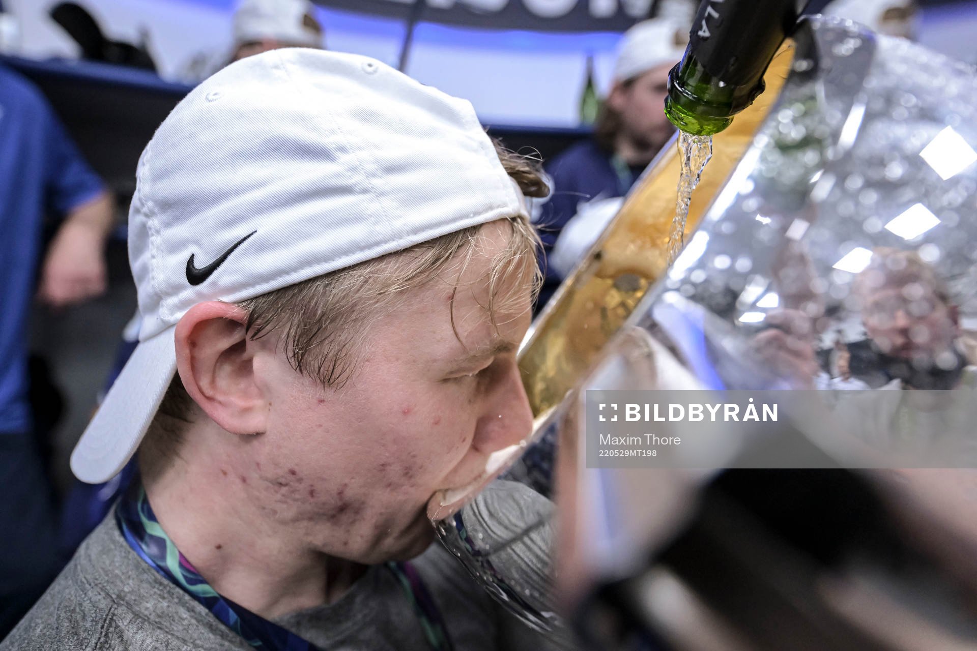 Toni Rajala of Finland celebrate in the locker room