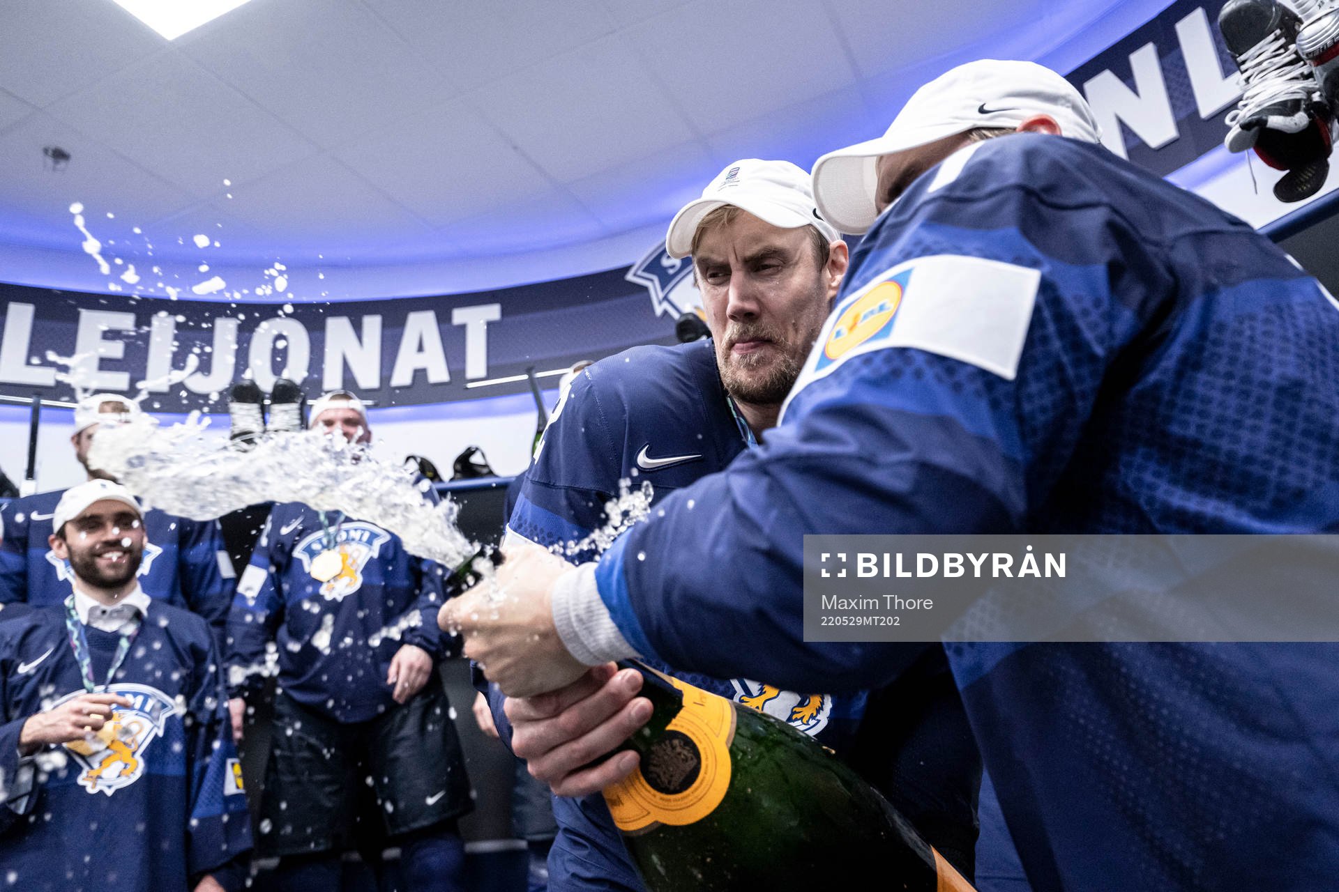 Marko Antilla and Valtteri Filppula of Finland celebrate in