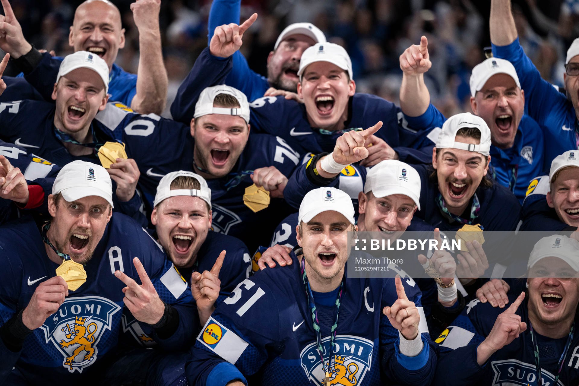 Marko Antilla and Valtteri Filppula of Finland celebrate