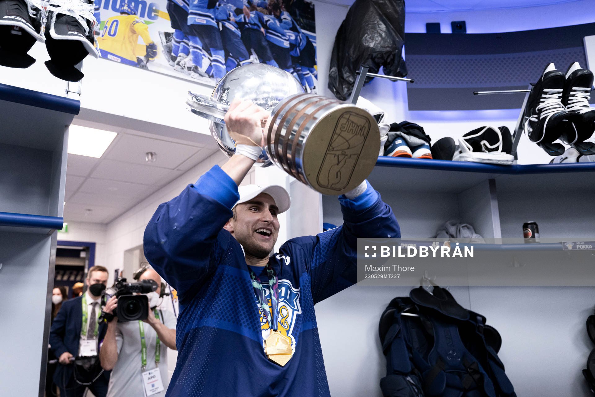 Valtteri Filppula of Finland celebrates with the trophy in