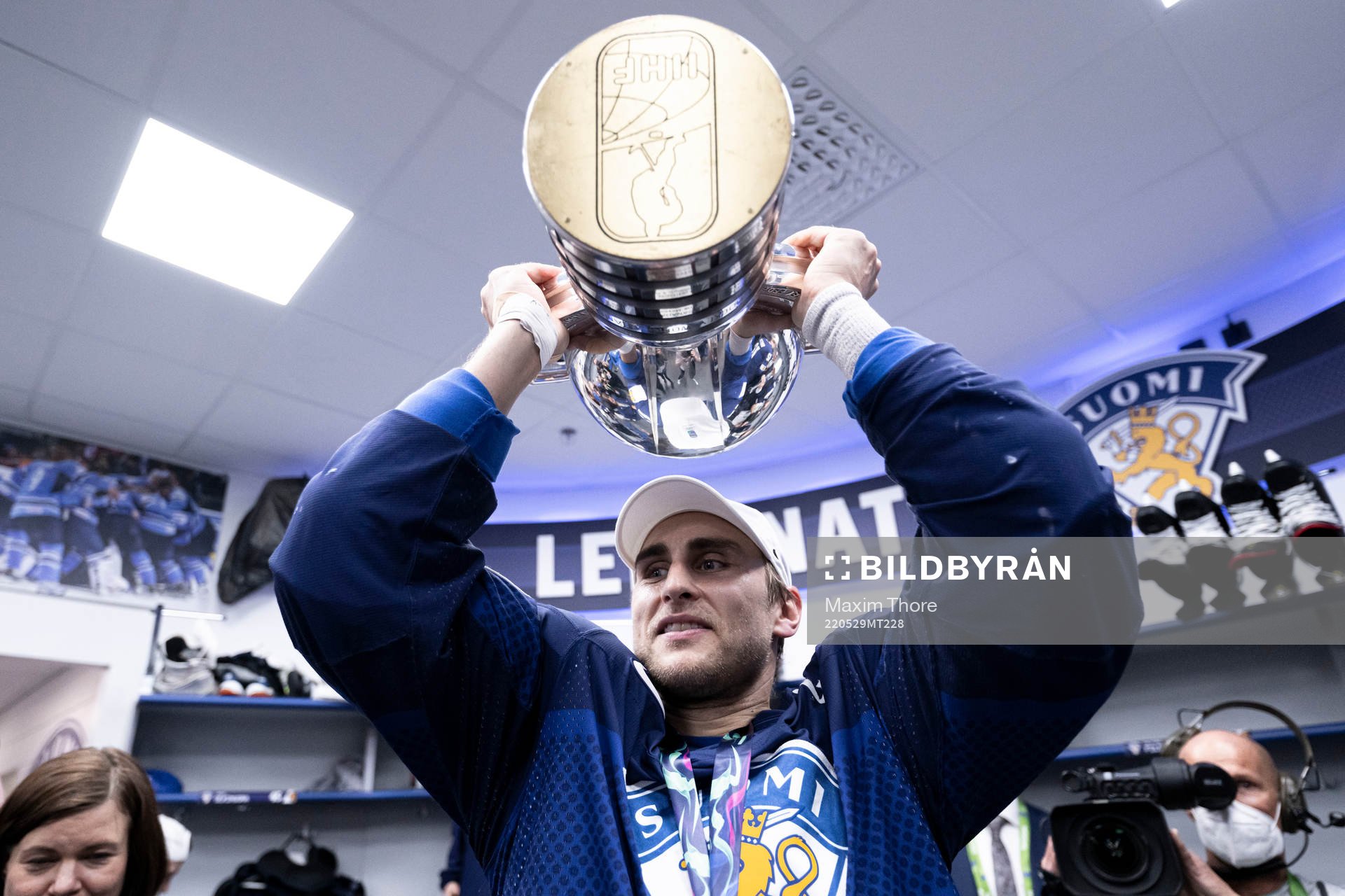 Valtteri Filppula of Finland celebrates with the trophy in