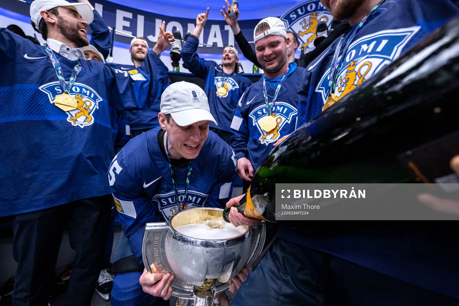 Atte Ohtamaa of Finland celebrates in the locker room with