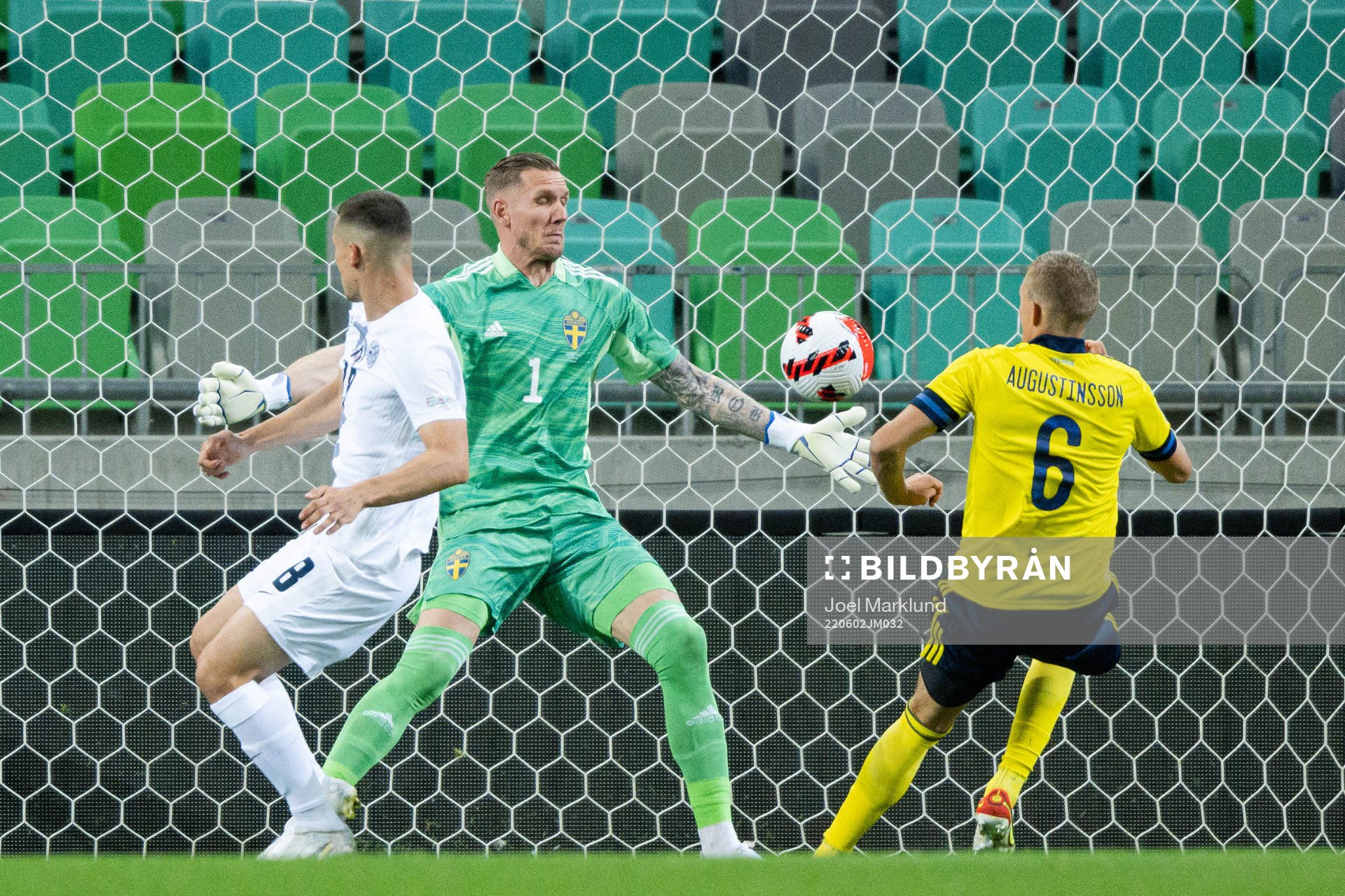 Sandi Lovric of Slovenia against goalkeeper Robin Olsen and