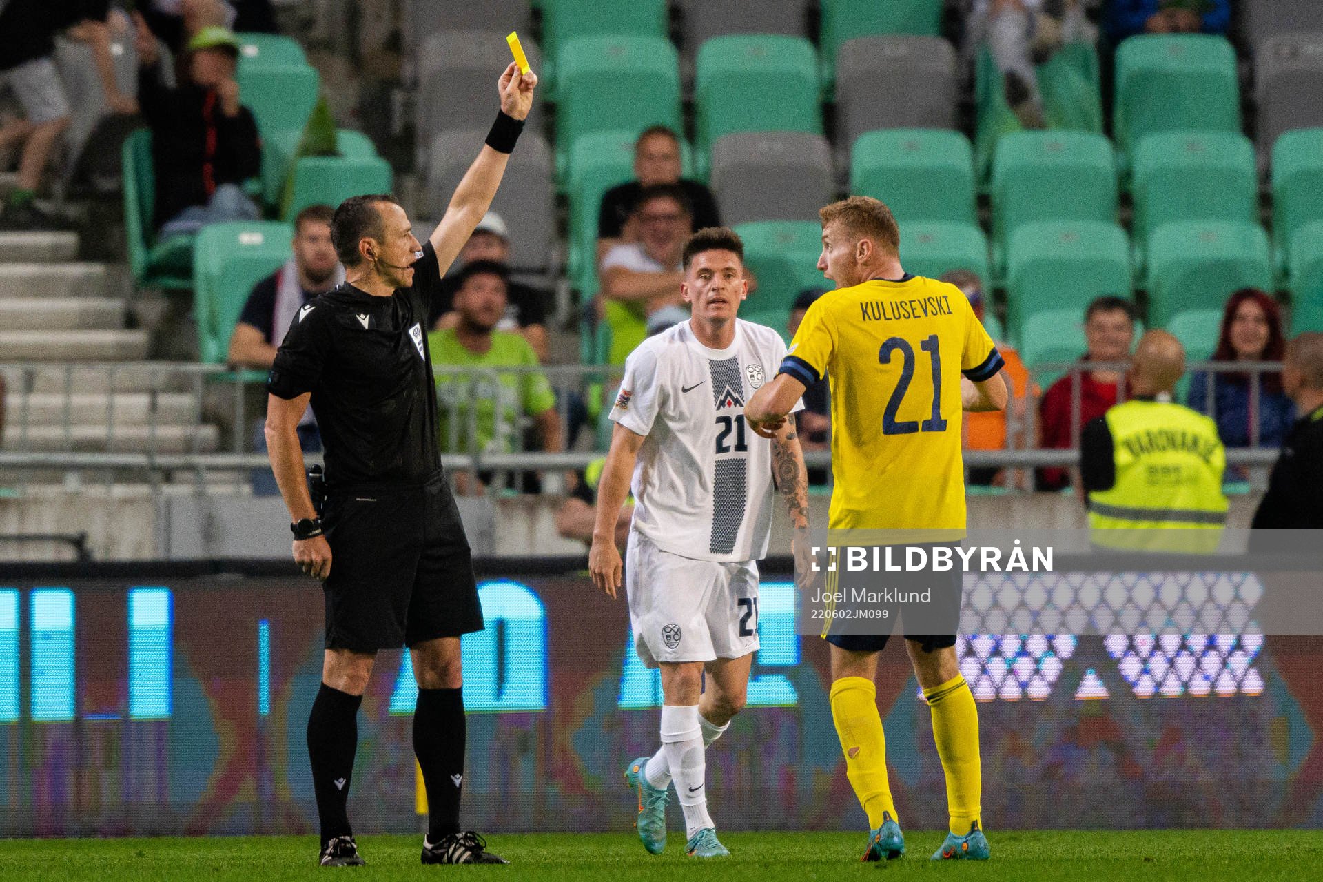 Referee Ruddy Buquet and Dejan Kulusevski of Sweden