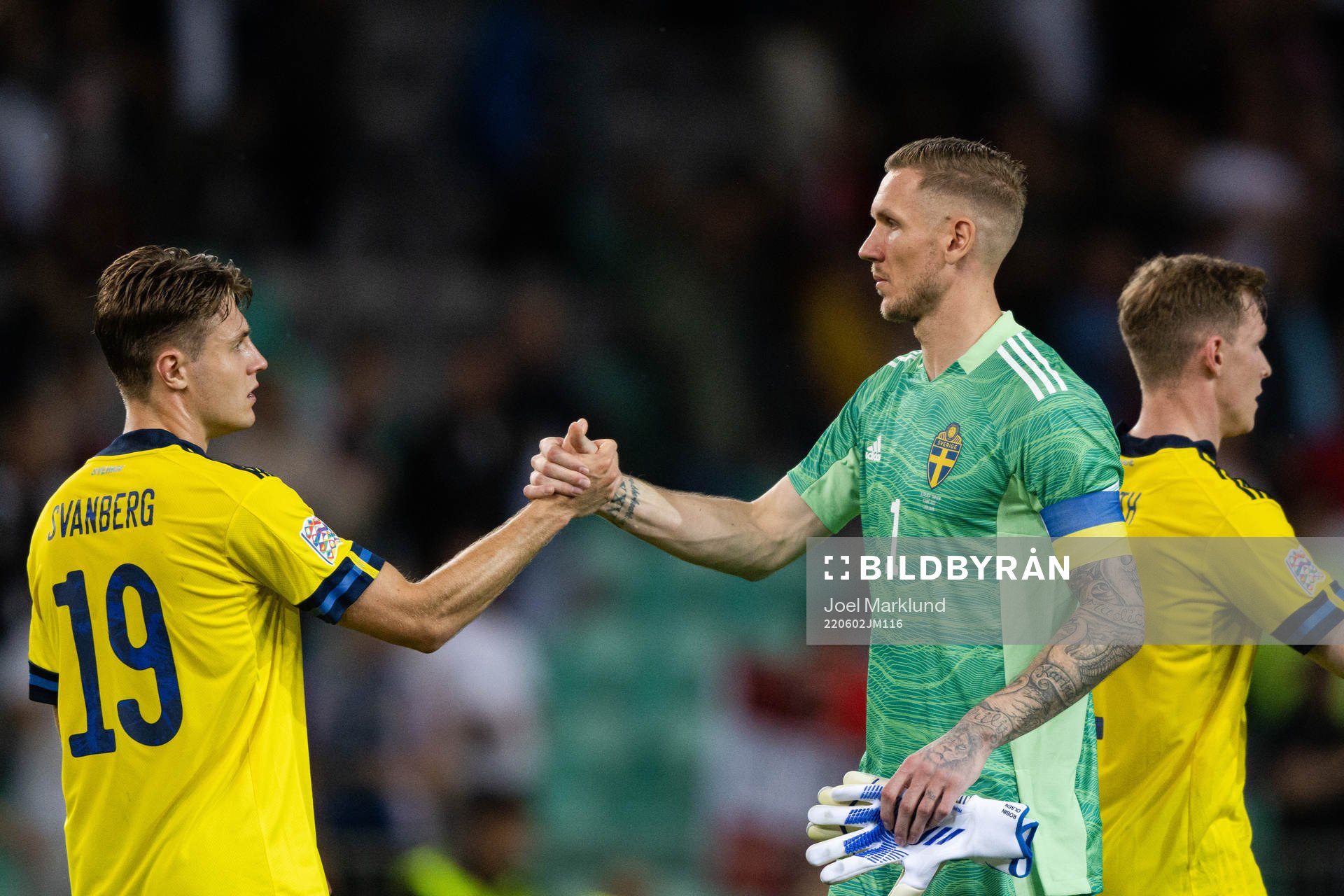 Mattias Svanberg and goalkeeper Robin Olsen of Sweden