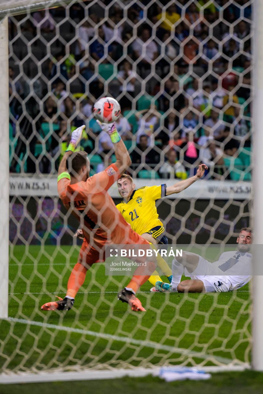 Dejan Kulusevski of Sweden scores 0-2 behind goalkeeper Jan