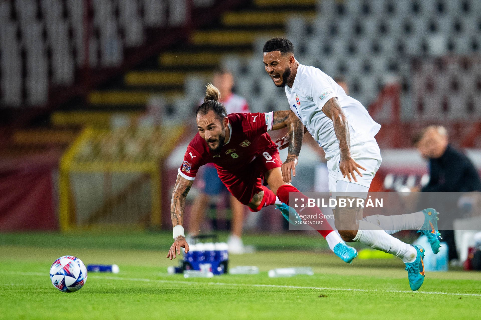 Nemanja Gudelj of Serbia and Joshua King of Norway