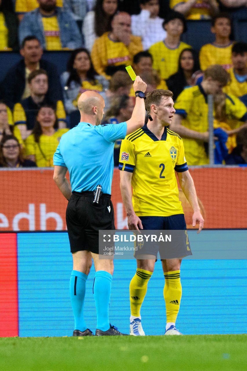 Emil Krafth of Sweden is shown a yellow card