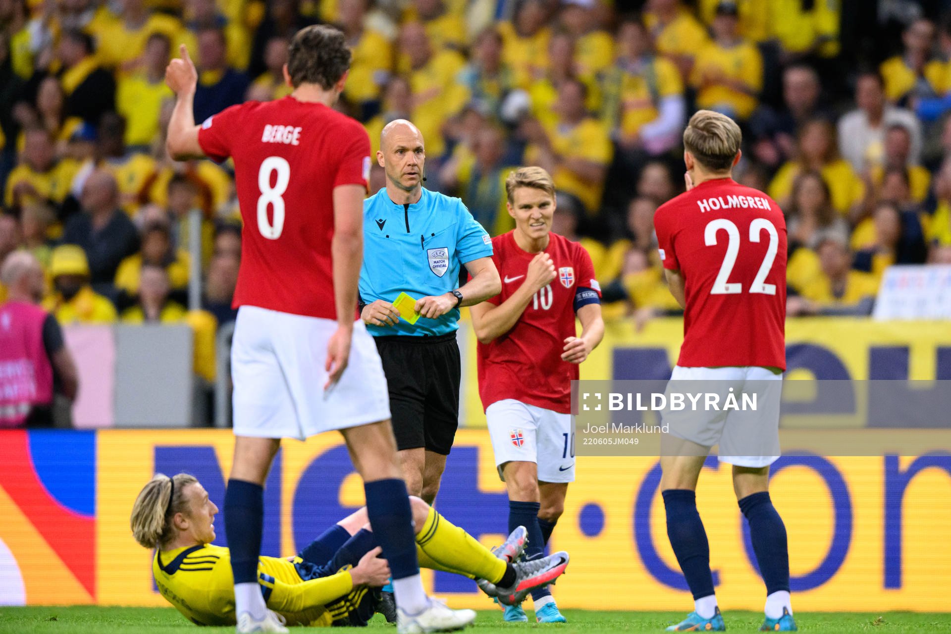 Marcus Holmgren Pedersen of Norway receives a yellow card