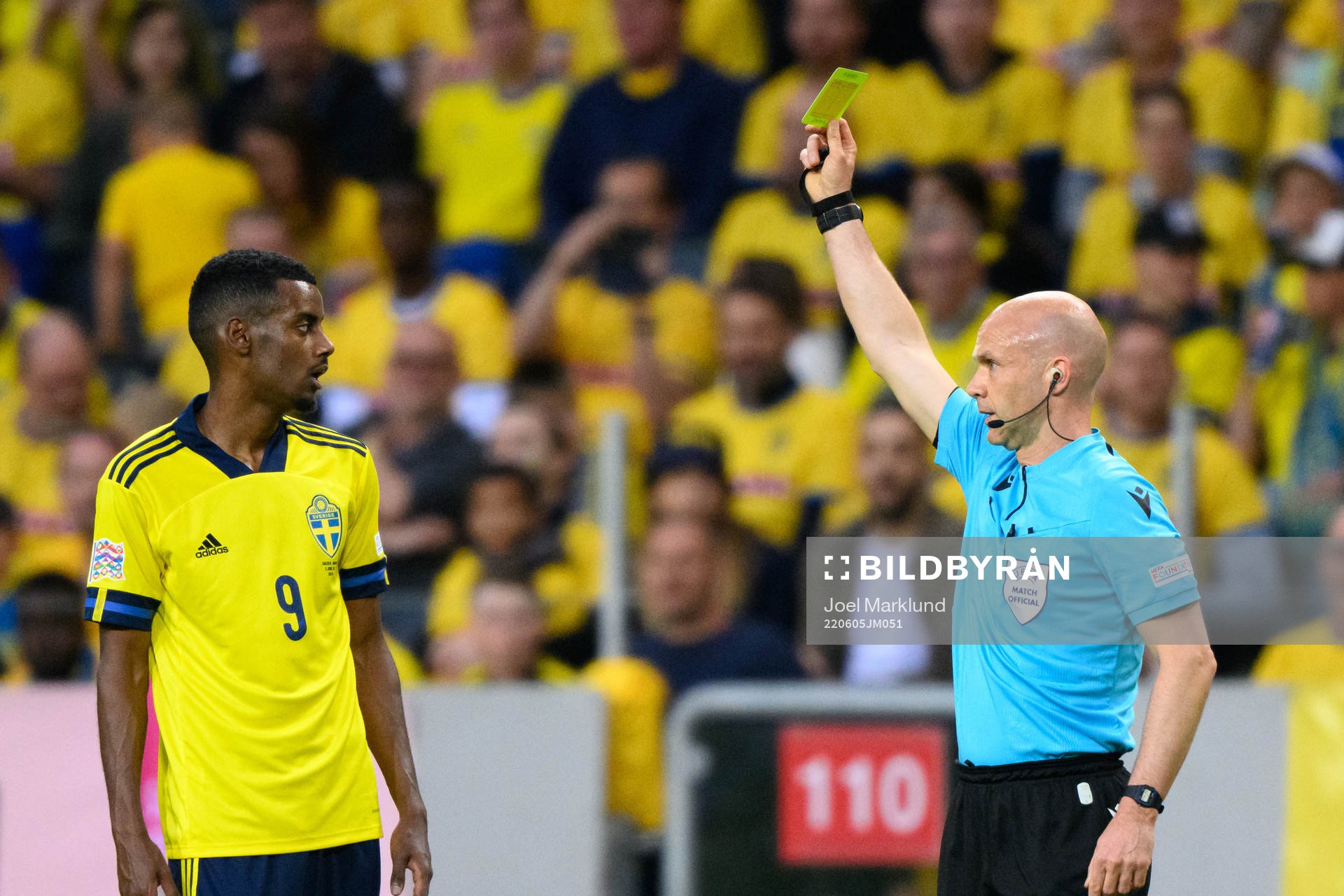 Alexander Isak of Sweden is shown a yellow card by referee
