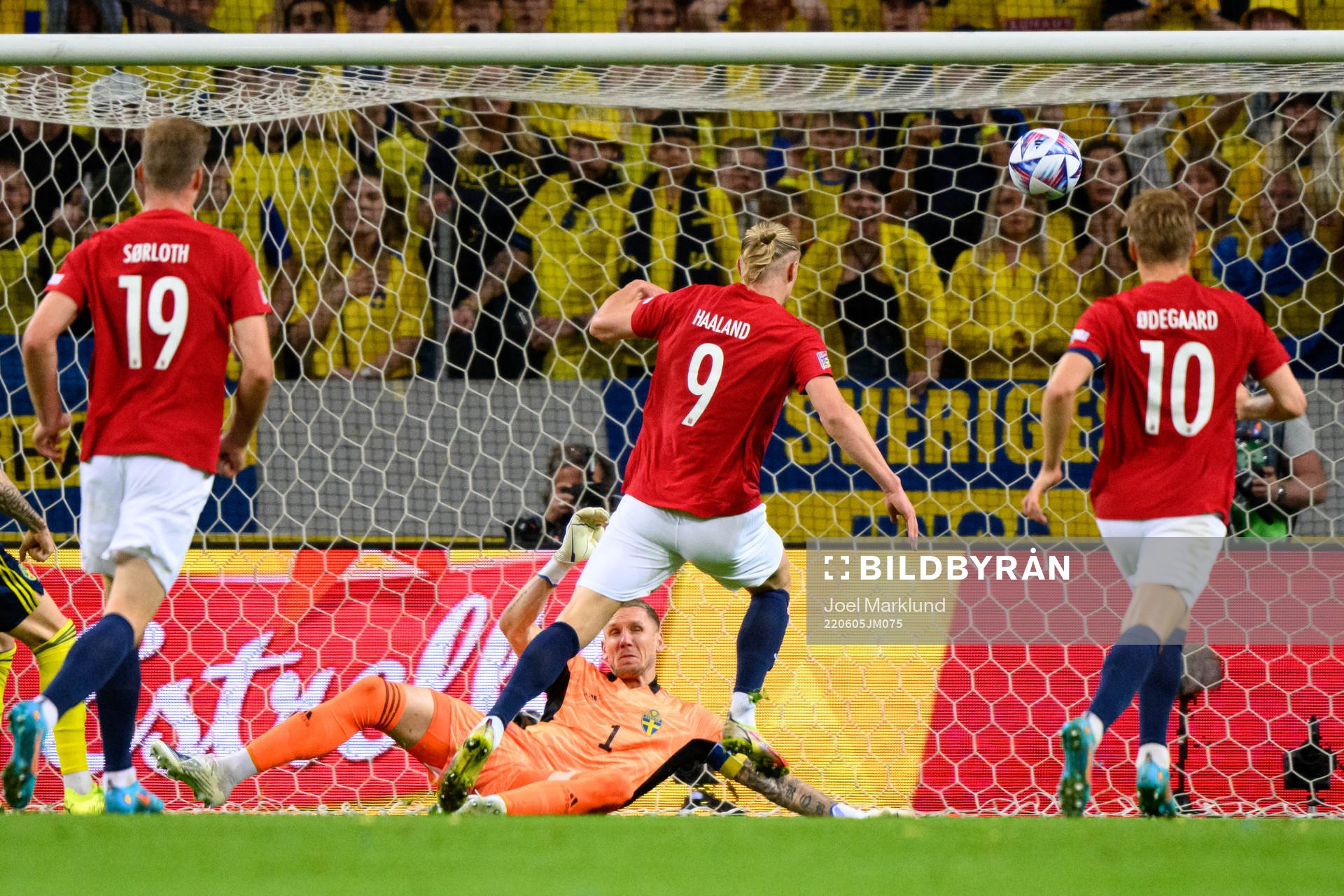 Goalkeeper Robin Olsen of Sweden saves a shot from Erling
