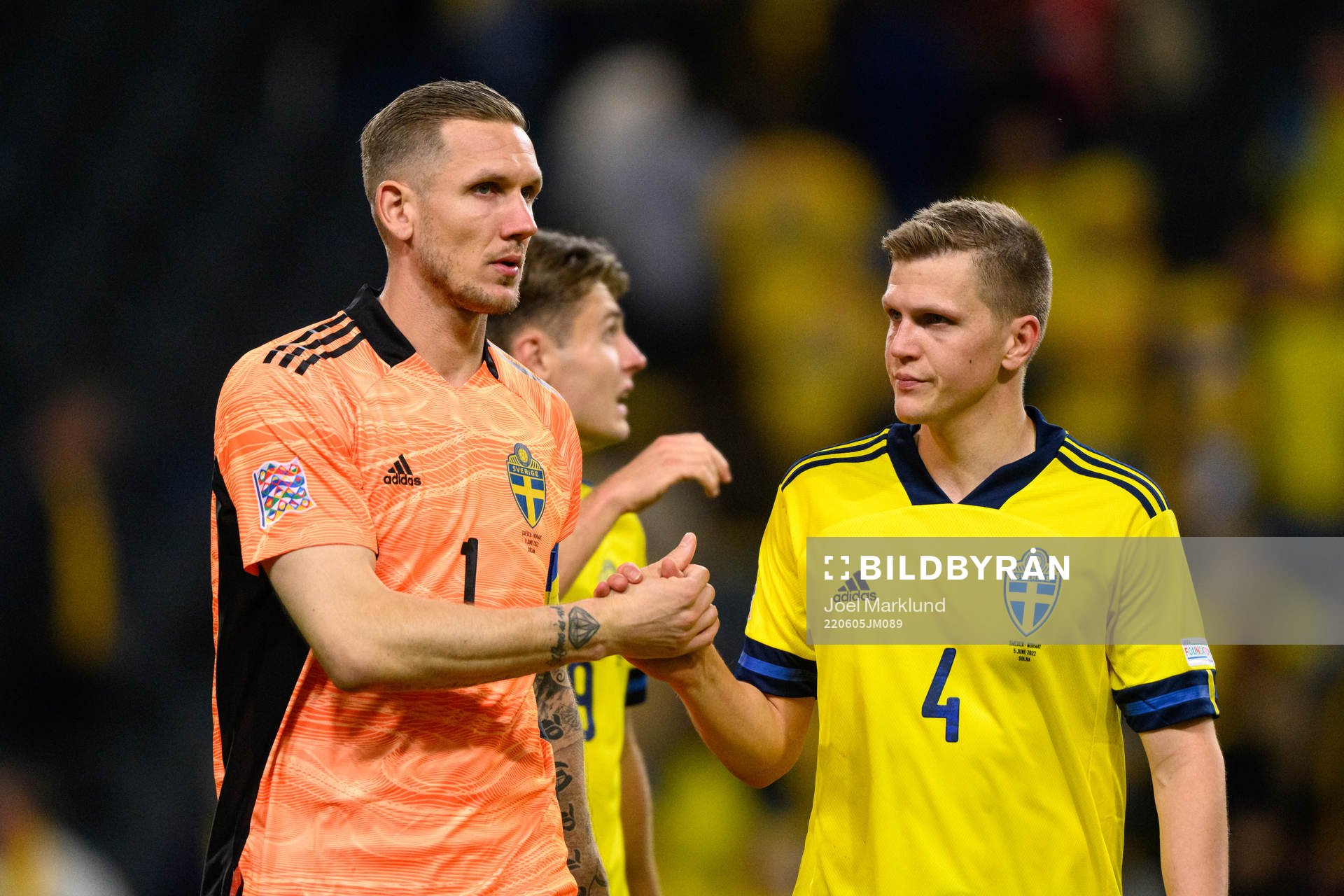 Goalkeeper Robin Olsen and Joakim Nilsson of Sweden