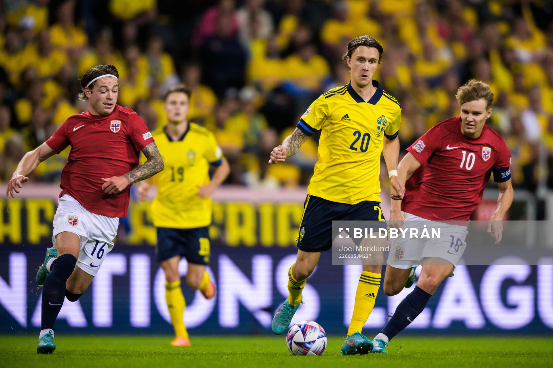 Patrick Berg and Martin Ødegaard of Norway are being
