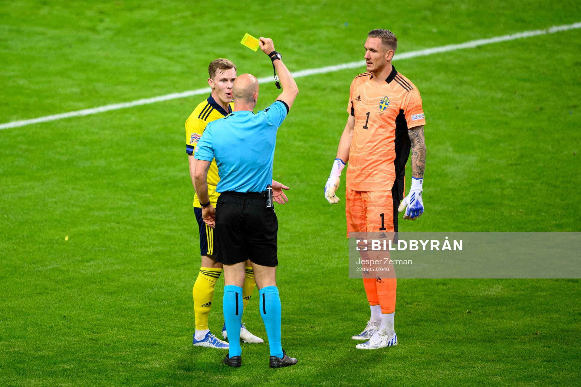 Emil Krafth of Sweden is shown a yellow card