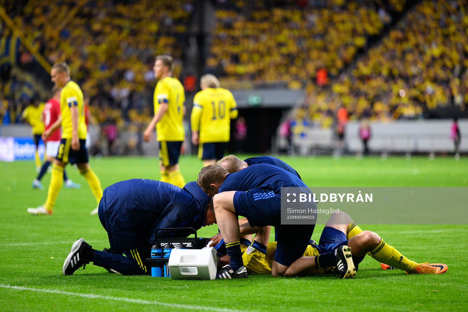 Viktor Claesson of Sweden receives medical attention