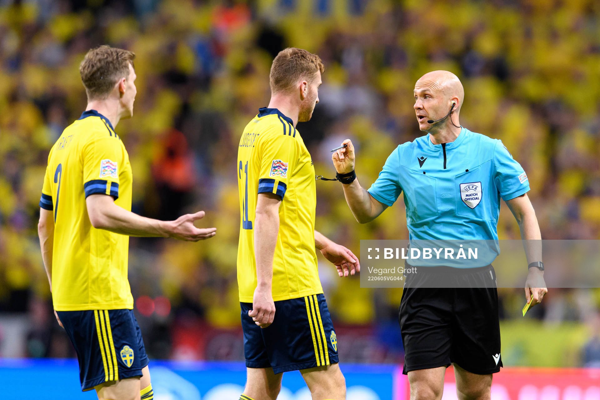 Emil Krafth and Dejan Kulusevski of Sweden talks to referee