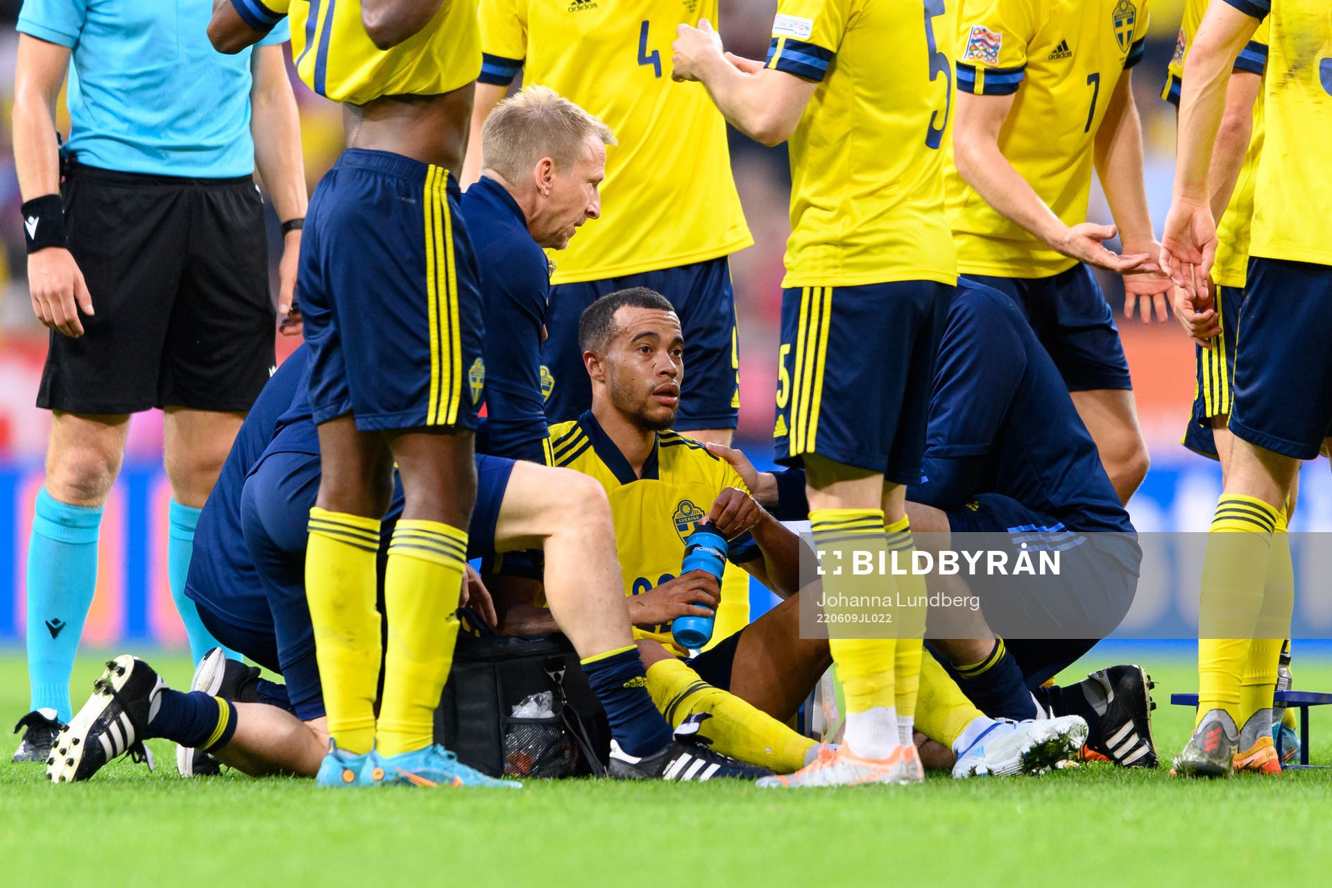 Robin Quaison of Sweden receive medical attention