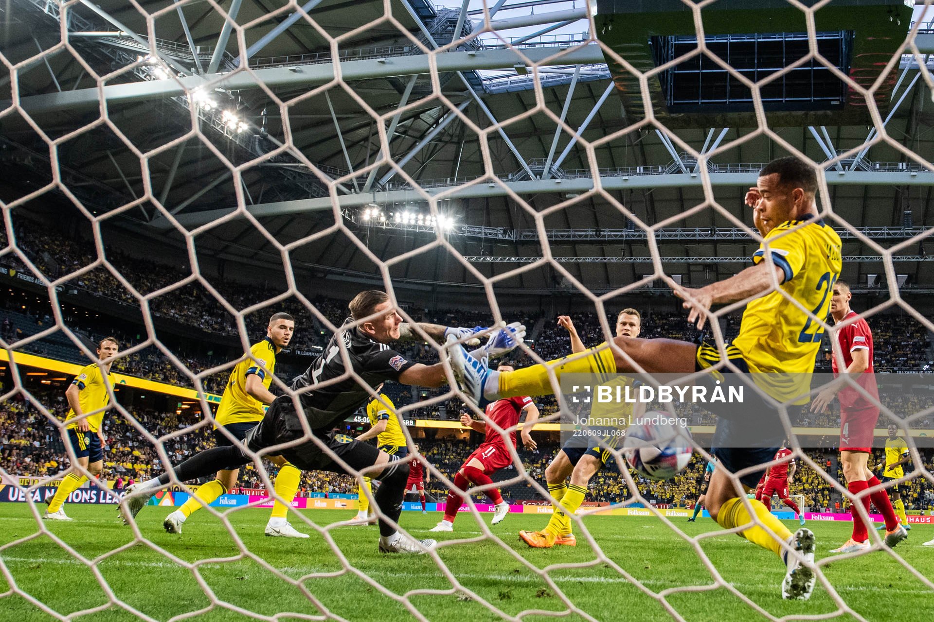 Nikola Milenkovic of Serbia scores 0-1 behind goalkeeper