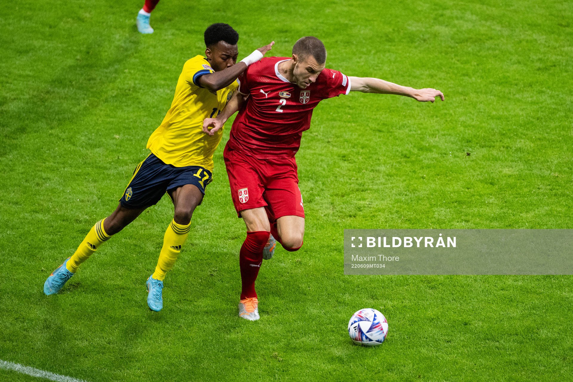 Anthony Elanga of Sweden and Strahinja Pavlovic of Serbia