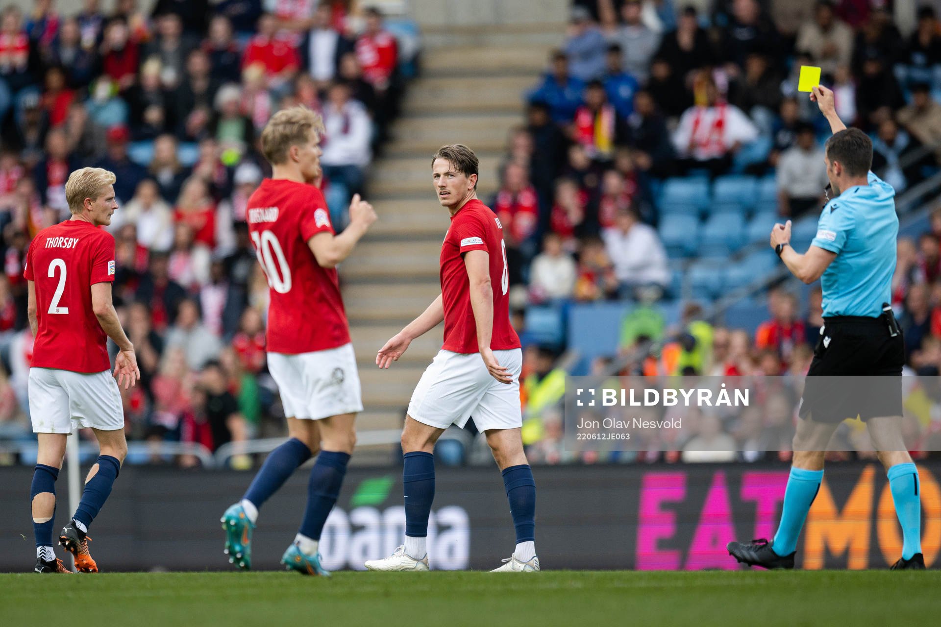 Sander Berge of Norway receives a yellow card