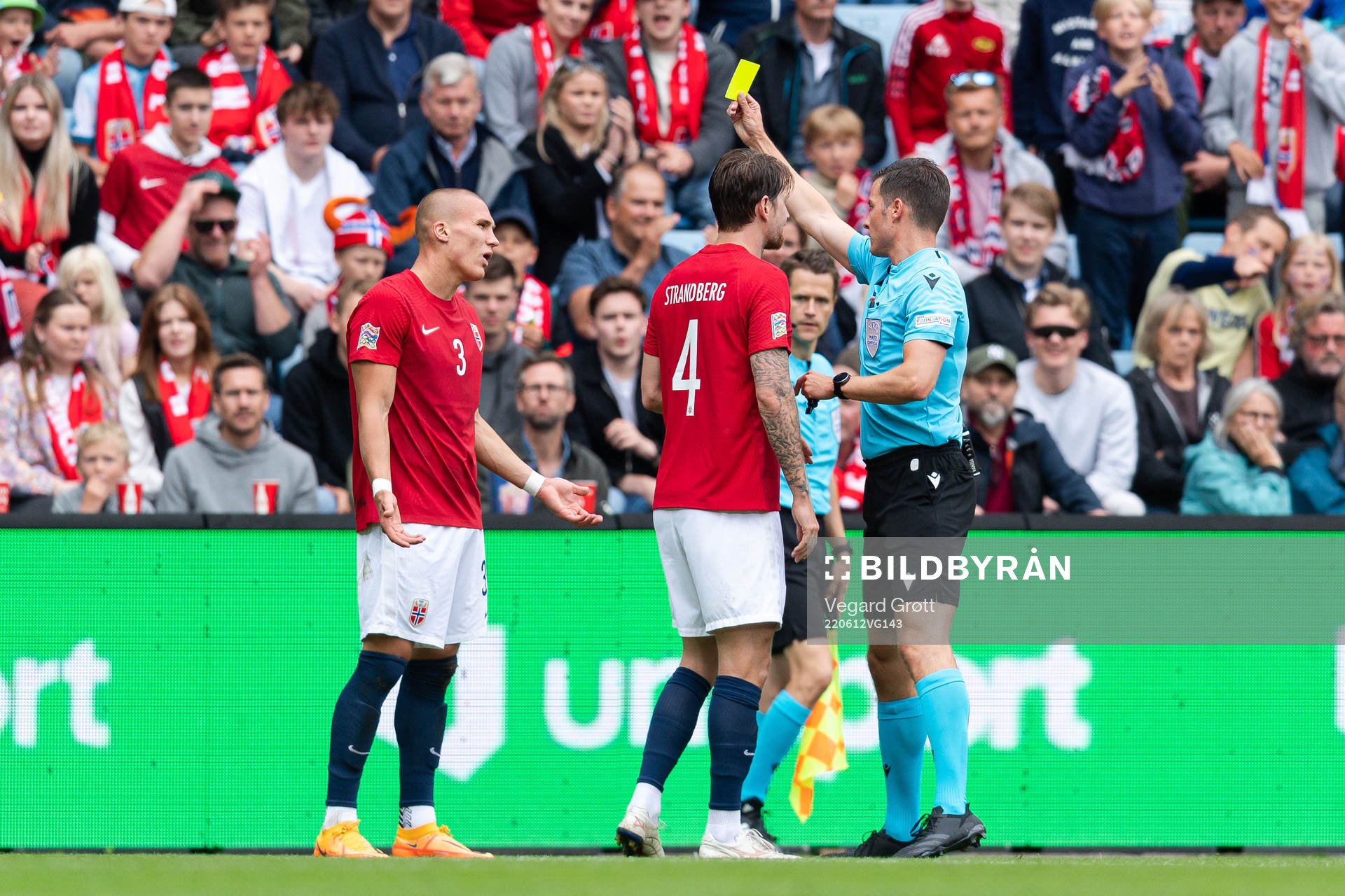 Leo Østigård of Norway receives a yellow card