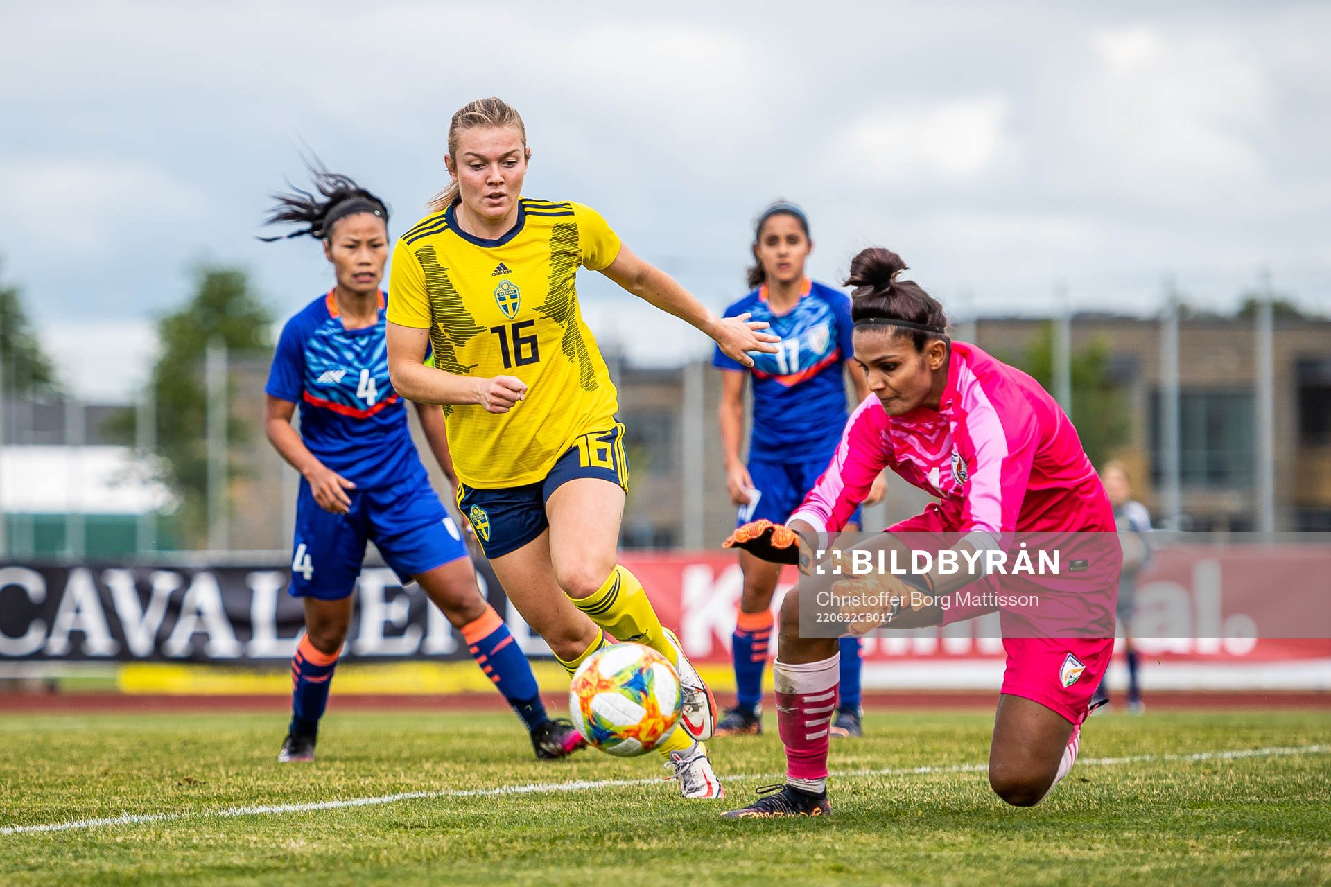 Beata Olsson of Sweden and goalkeeper Aditi Chauhan of India