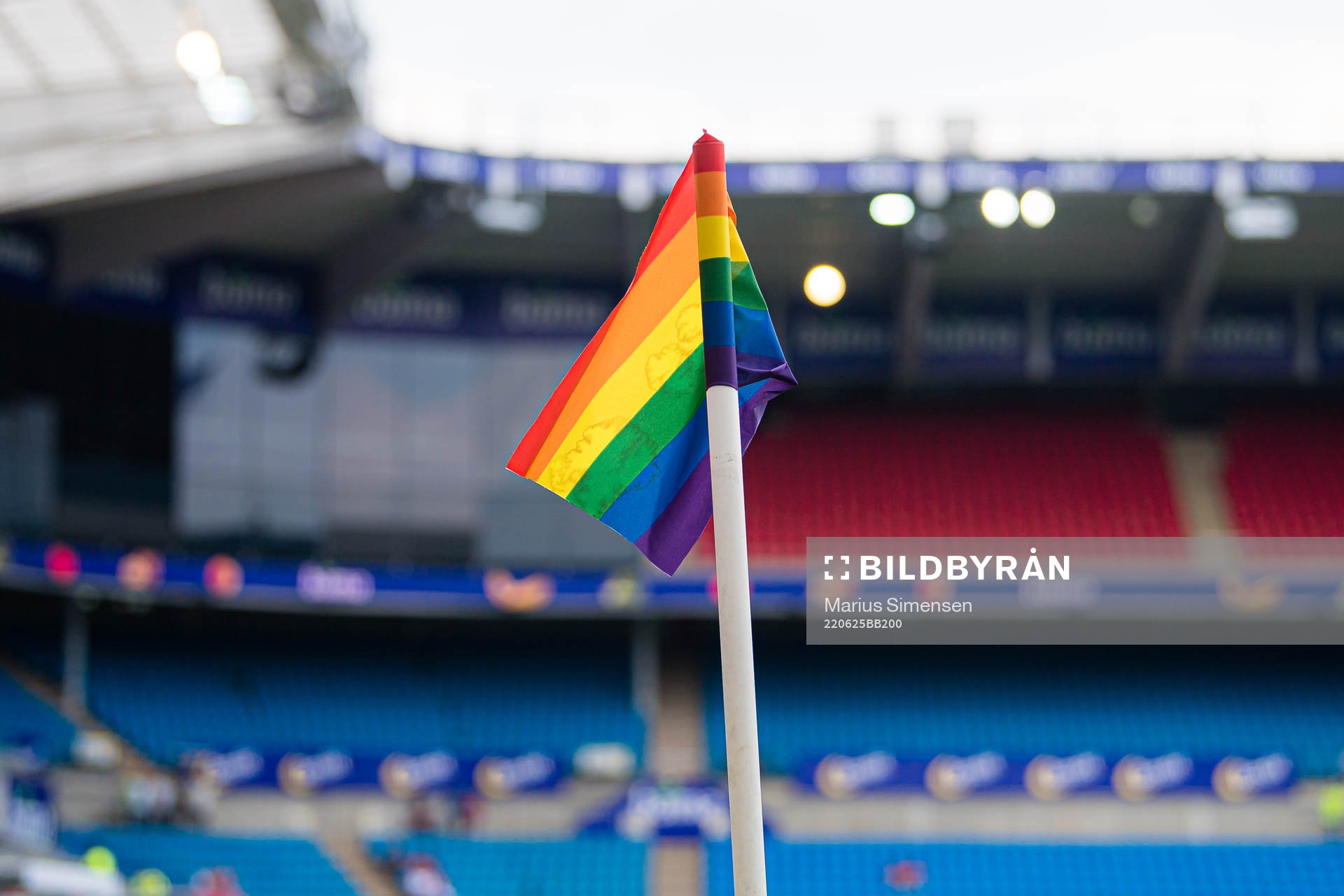 A rainbow-colored corner flag