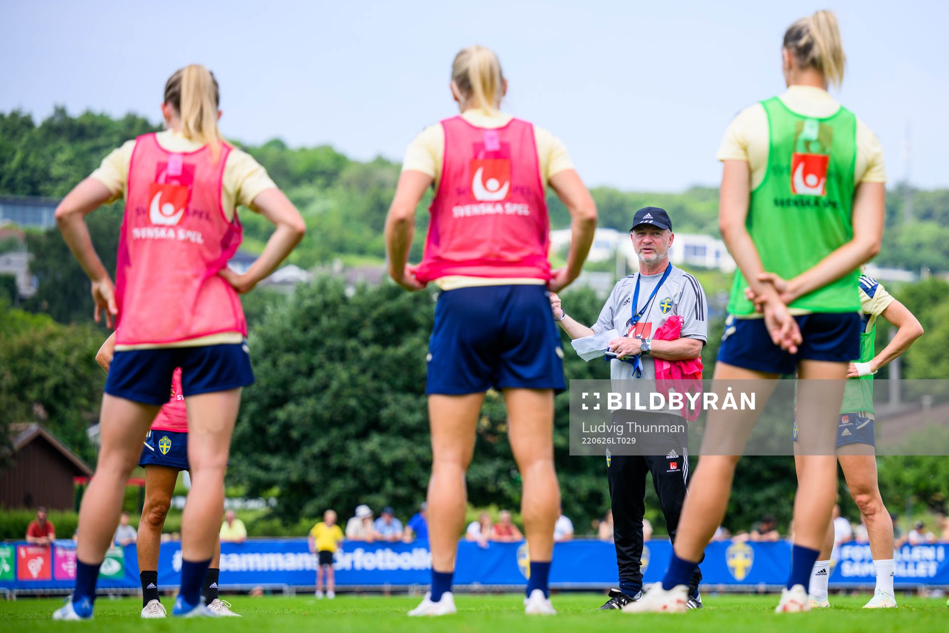 Players gather around Peter Gerhardsson, head coach during a training session with the women's national football team of Sweden on June 26, 2022 in Båstad. 