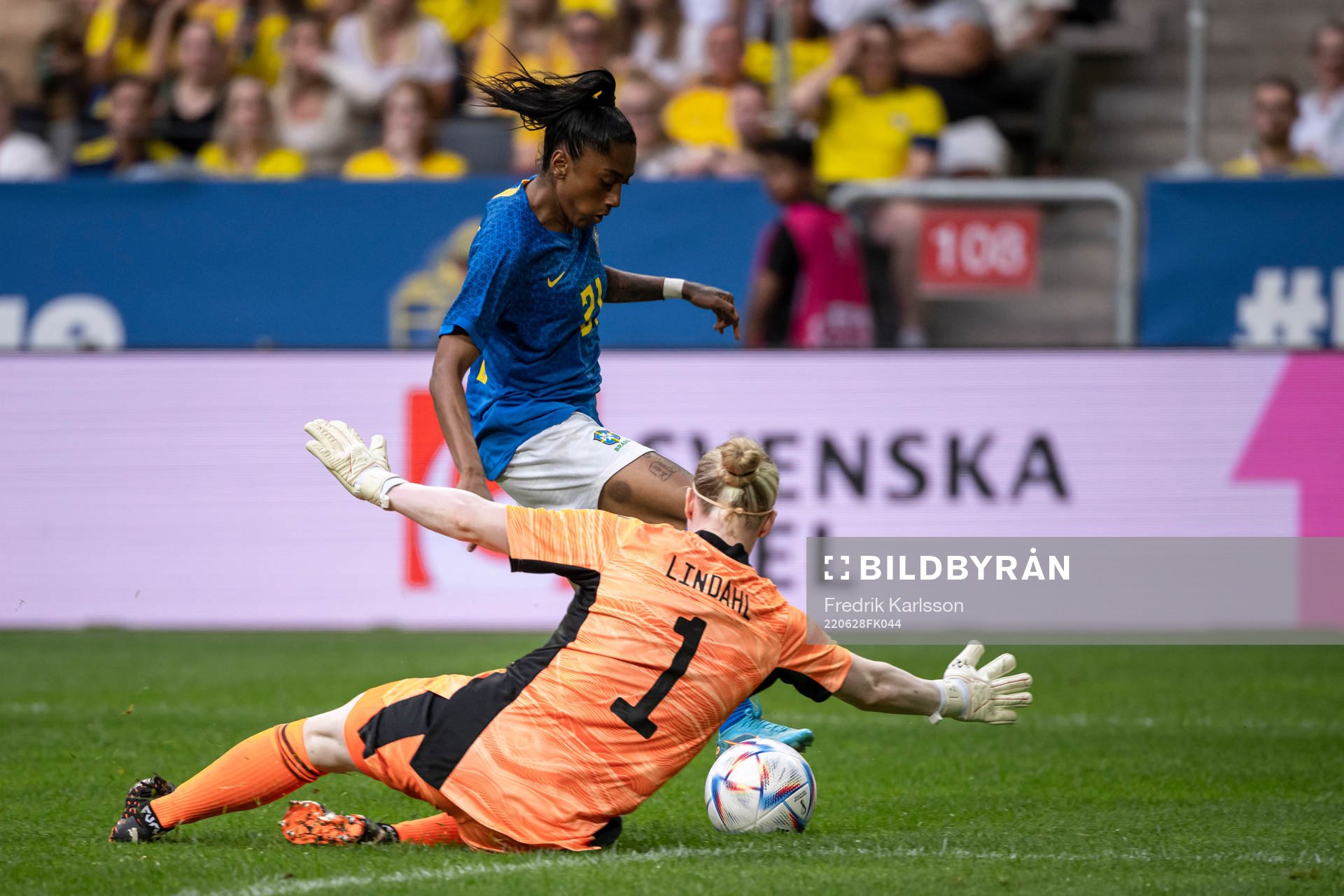 Kerolin of Brazil and goalkeeper Hedvig Lindahl of Sweden