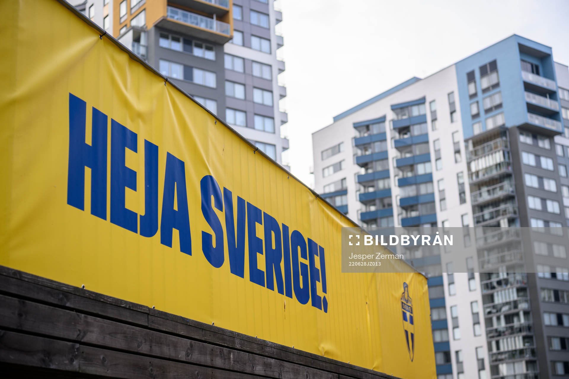 A banner with ”heja sverige” outside of the arena