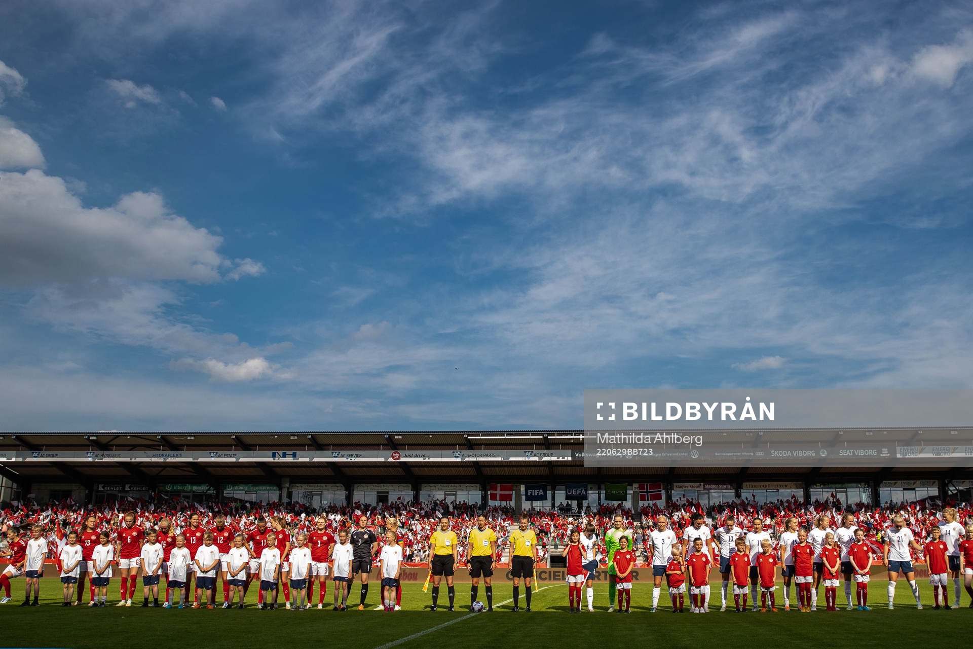 Players of Denmark and Norway with the referees