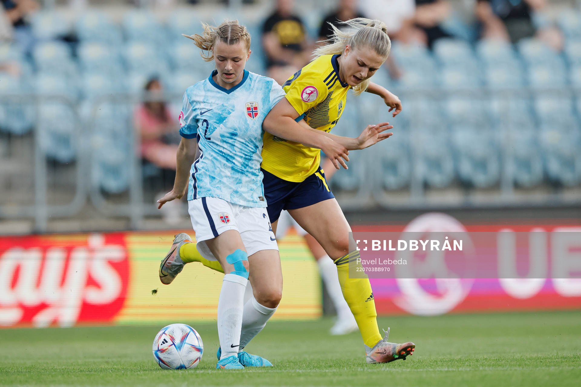 Lisa Björk  of Sweden in action against Thea Sørbo of