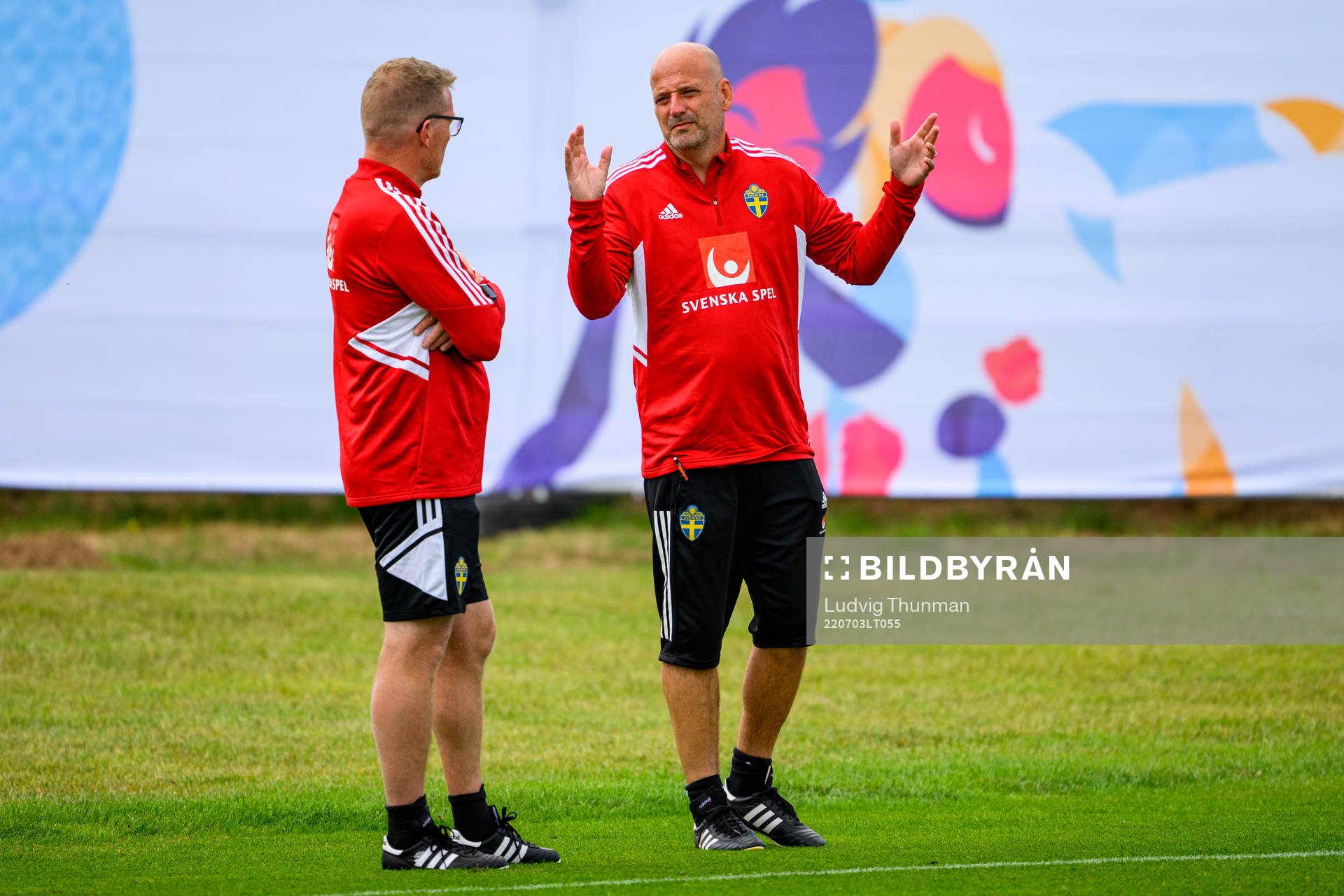 Magnus Wikman, assistant coach speaks to Leif Troedsson, goalkeeper coach during a training session with the the women's Swedish national football team ahead of UEFA Women's Euro 2022 Championship on July 3, 2022 in Chester.