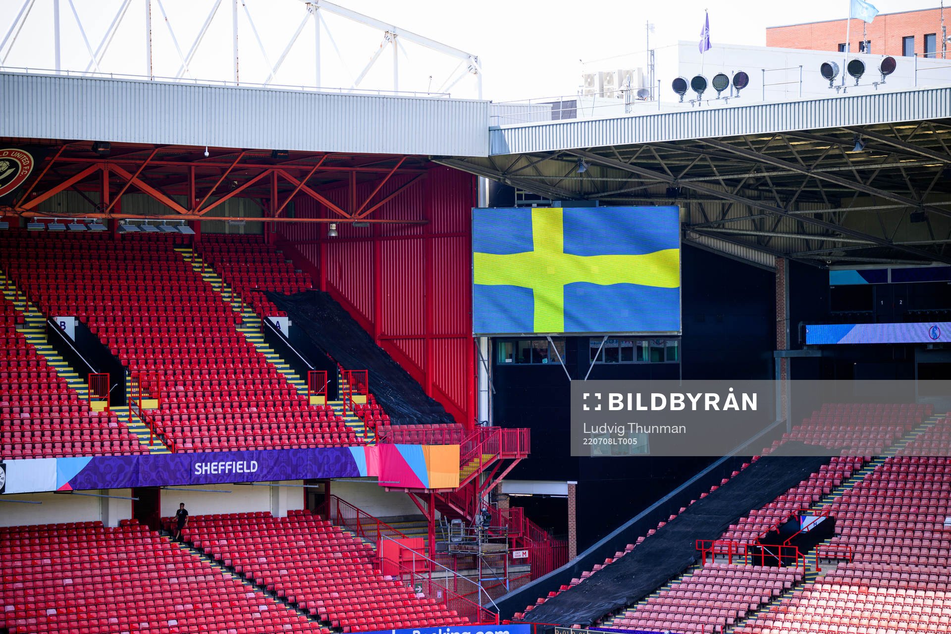 Interior view of Bramall Lane with a monitor showing a