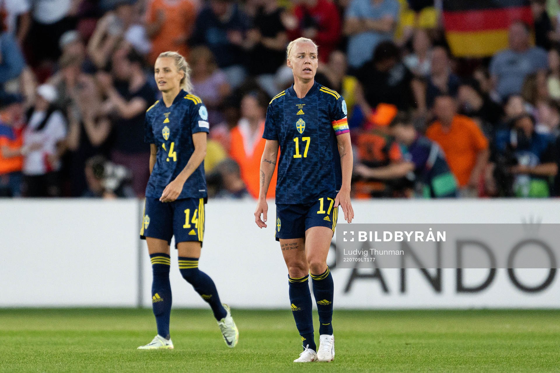 Nathalie Björn and Caroline Seger of Sweden look dejected