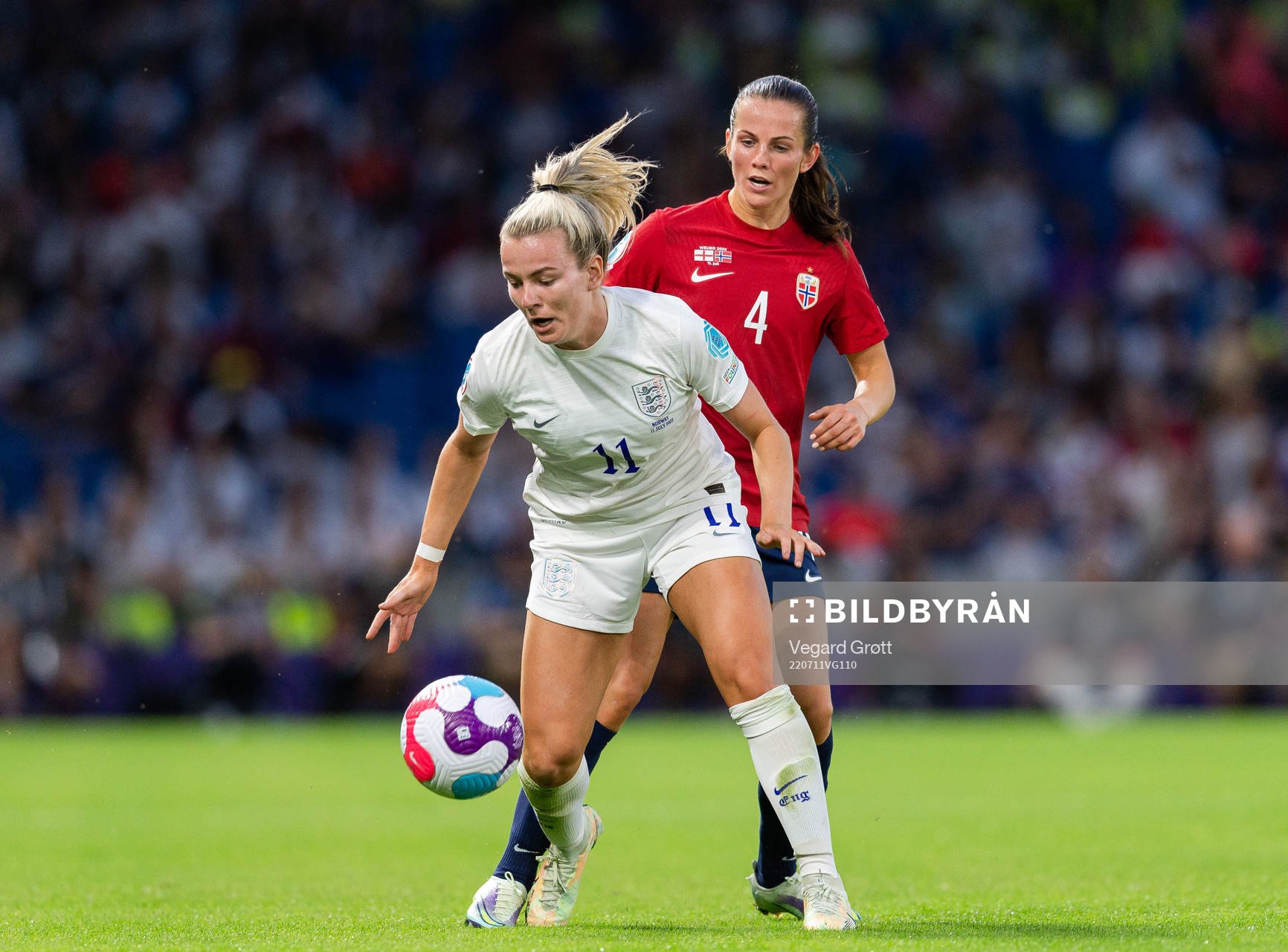 Lauren Hemp of England and Tuva Hansen of Norway during the UEFA Women's Euro 2022 group stage match between England and Norway on July 11, 2022 in Brighton. 