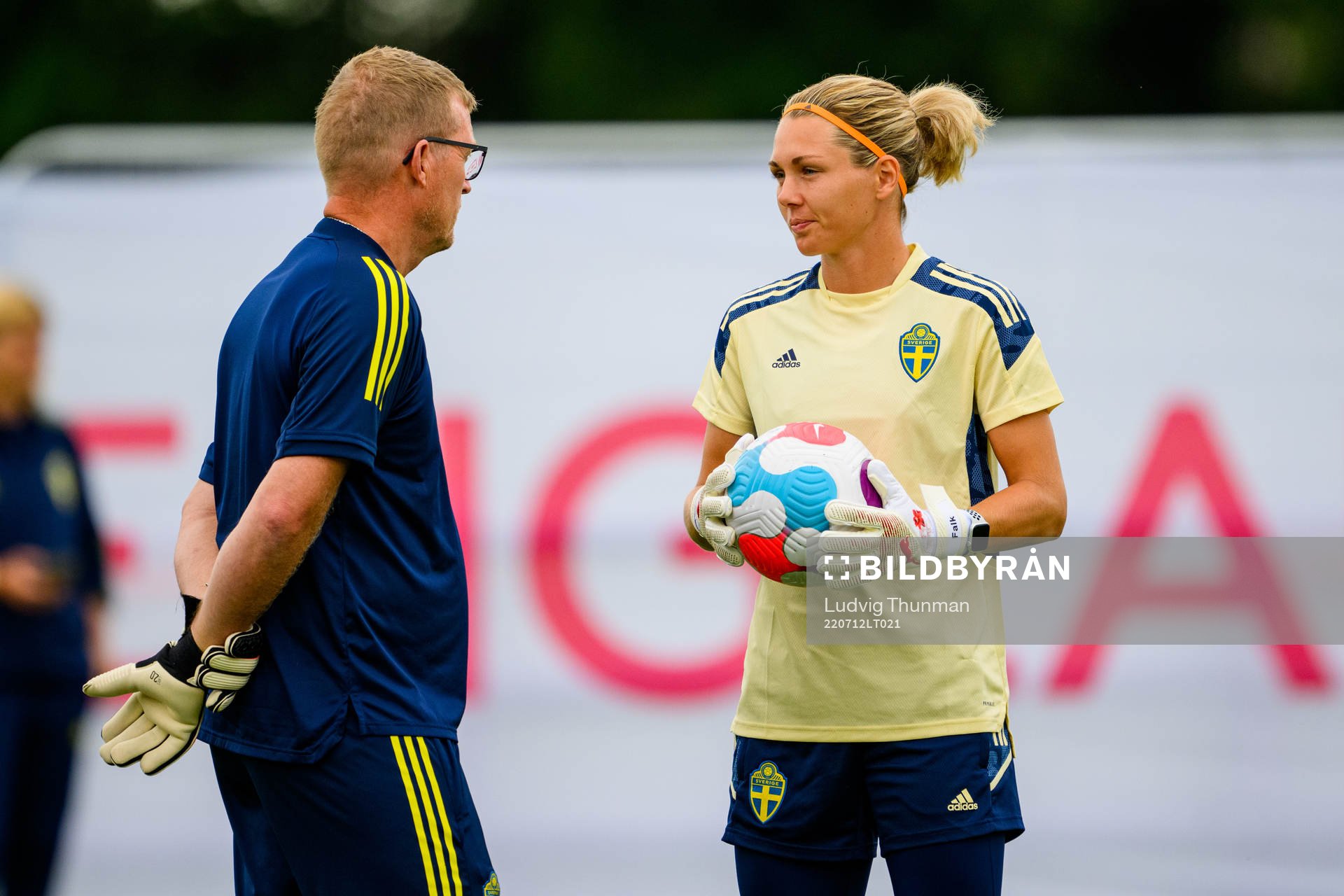 Leif Troedsson, goalkeeper coach speaks to goalkeeper Jennifer Falk of the Swedish women's national football team at a training session during the UEFA Women's Euro 2022 Championship on July 12, 2022 in Chester.