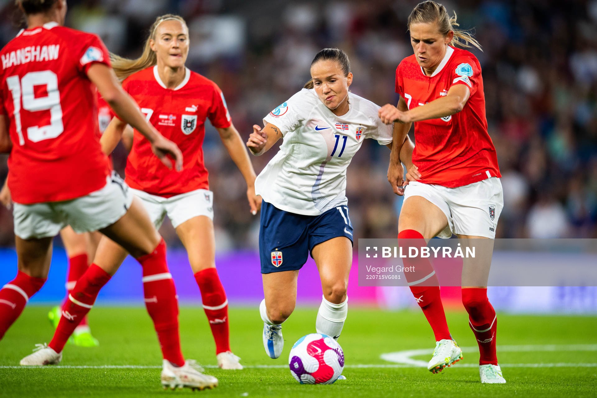 Guro Reiten of Norway and Carina Wenninger of Austria during the UEFA Women's Euro 2022 group stage match between Austria and Norway on July 15, 2022 in Brighton.