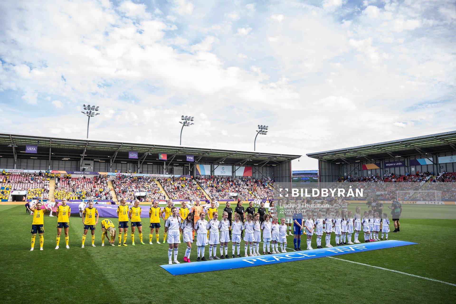 Players of Sweden and Portugal line up for the national anthems ahead of the UEFA Women's Euro 2022 group stage match between Sweden and Portugal on July 17, 2022 in Leigh.