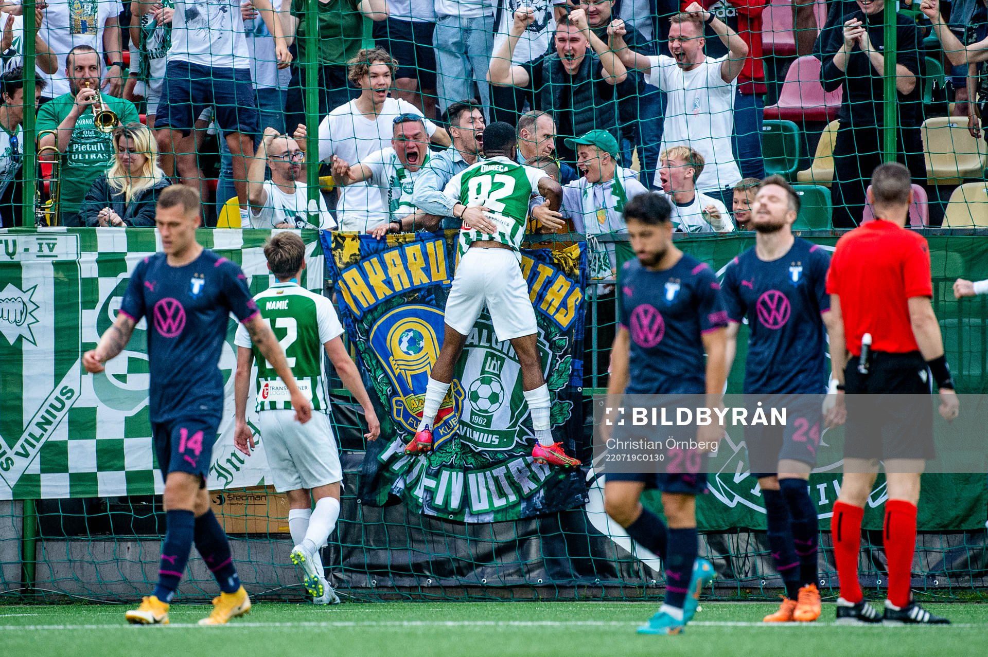 Fabien Ourega and the supporters of FK Zalgiris celebrate