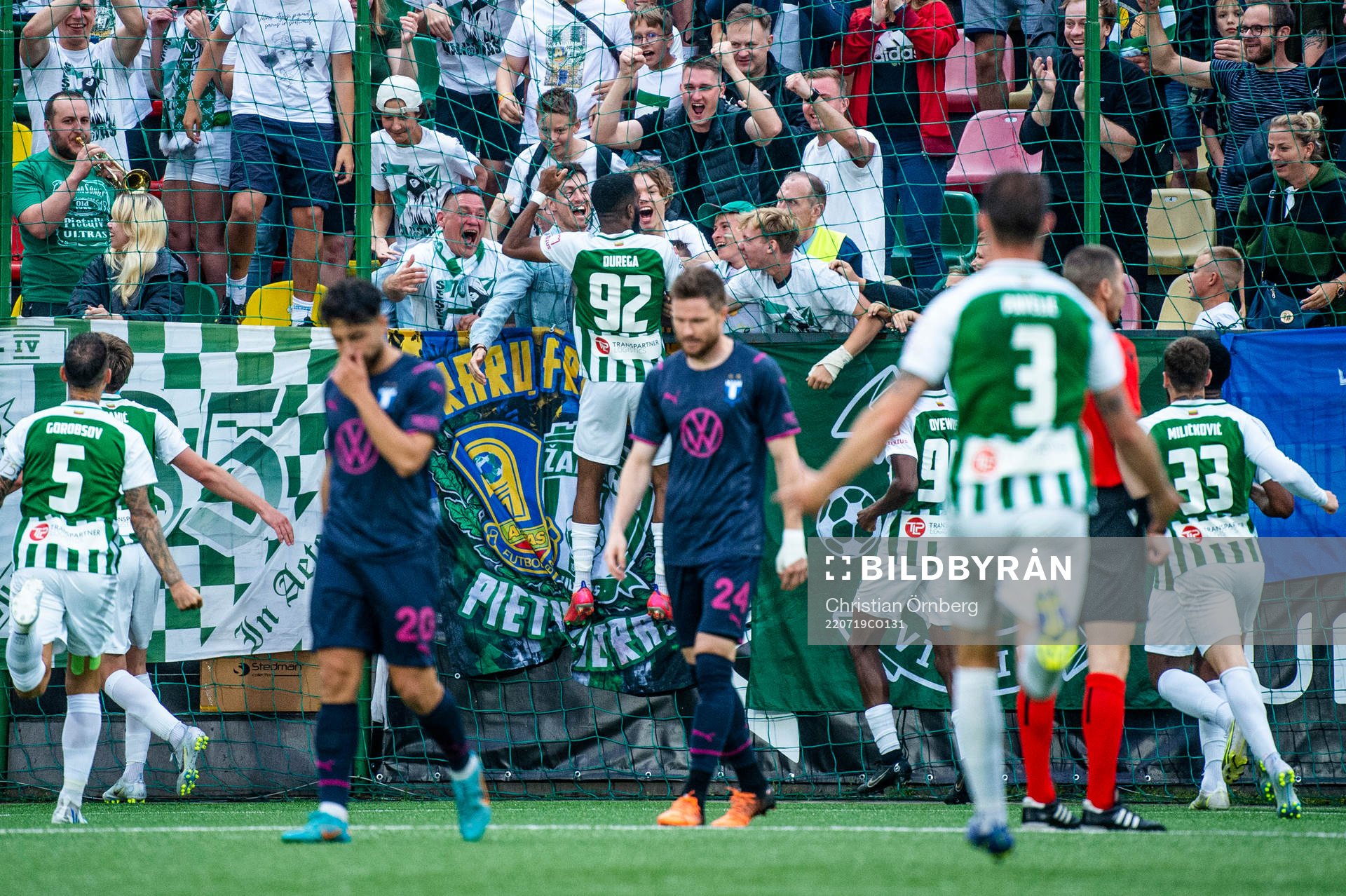 Fabien Ourega and the supporters of FK Zalgiris celebrate